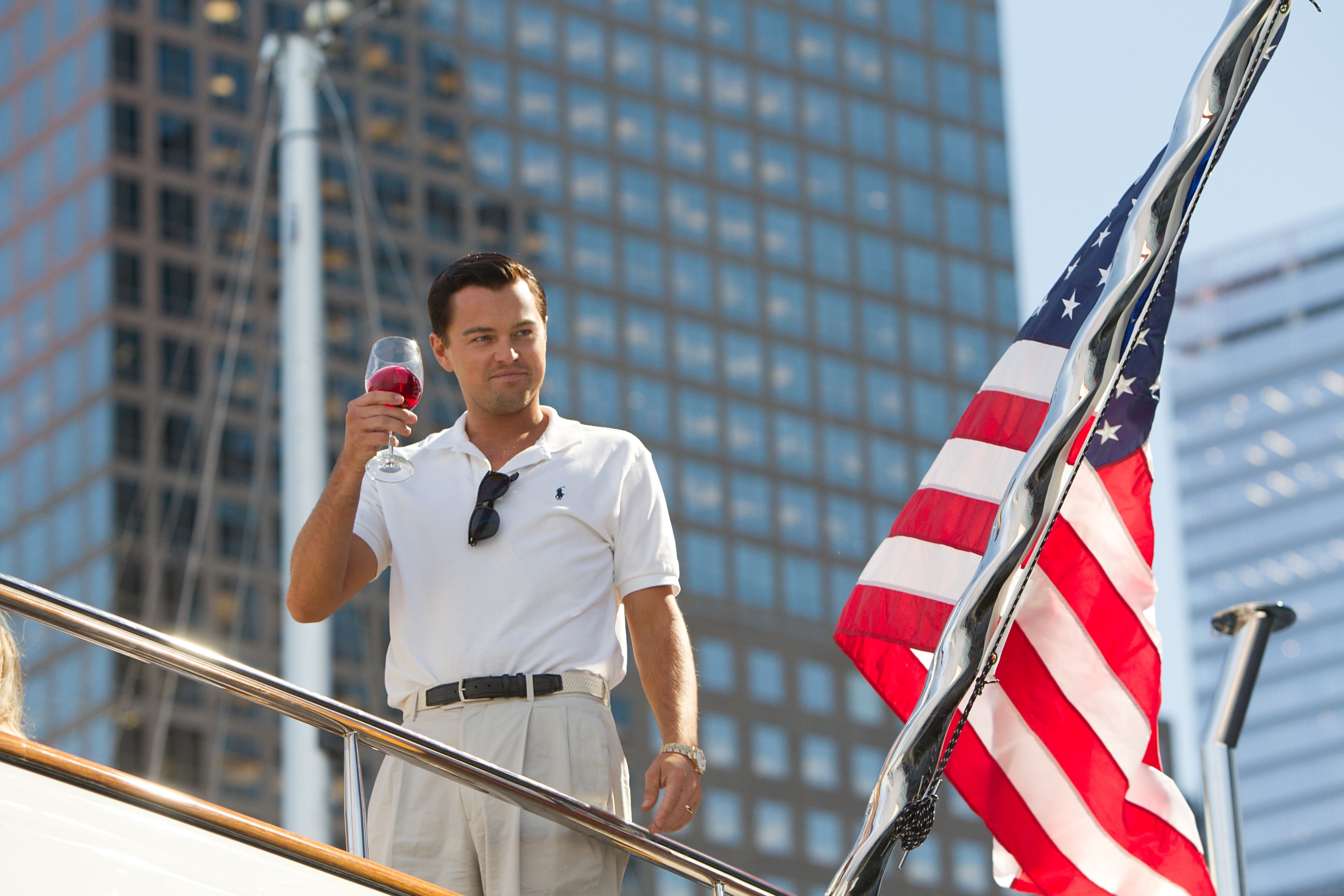 Leonardo DiCaprio on a yacht with American flag HD Wallpaper