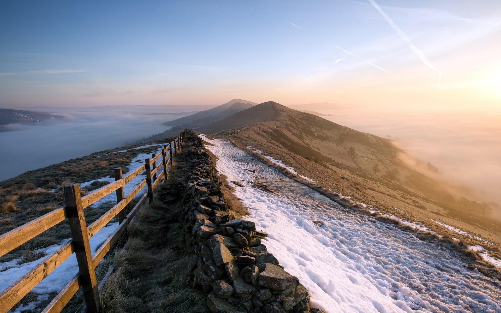Mountain ridge with fence and fog at sunrise HD Wallpaper