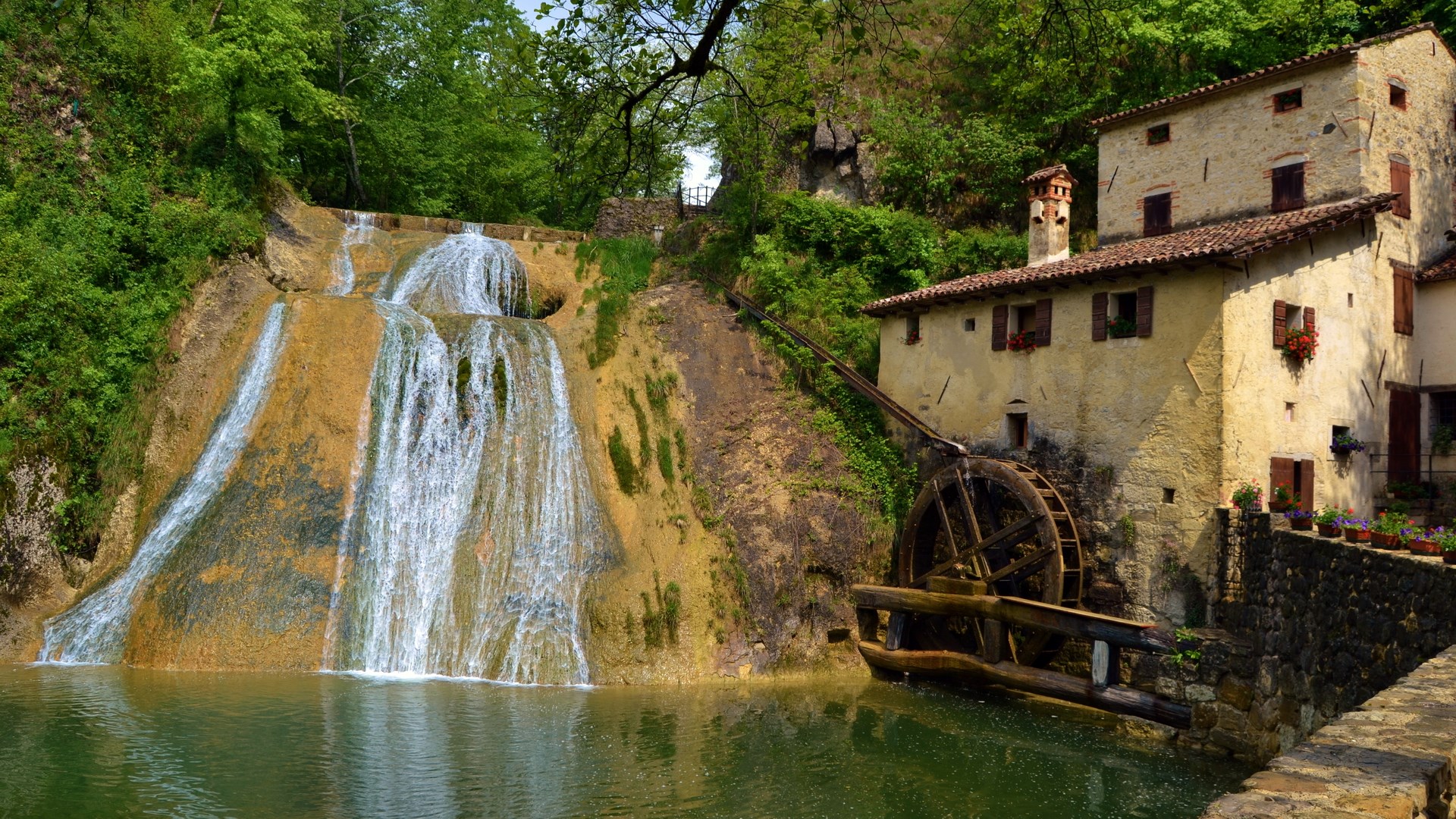 Waterfall and old mill building in a forest HD Wallpaper