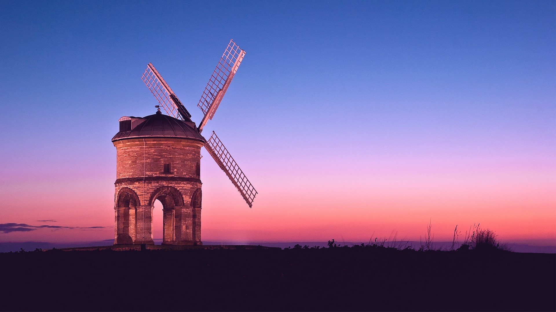 Windmill at sunset with colorful sky HD Wallpaper