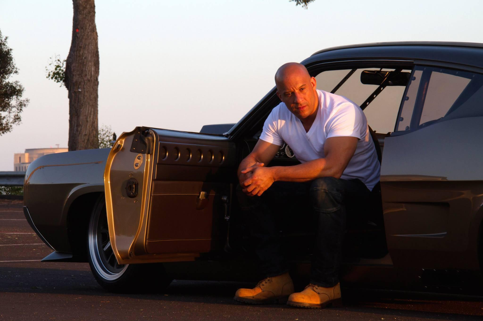 Vin Diesel sitting in a car HD Wallpaper