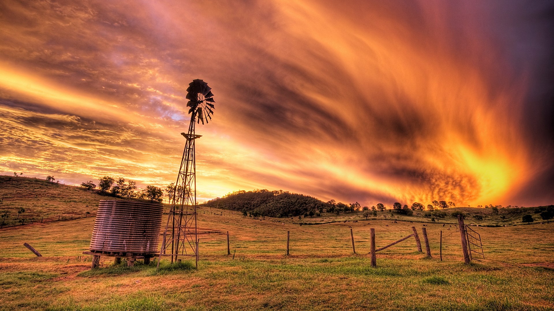 Windmill and water tank at sunset HD Wallpaper
