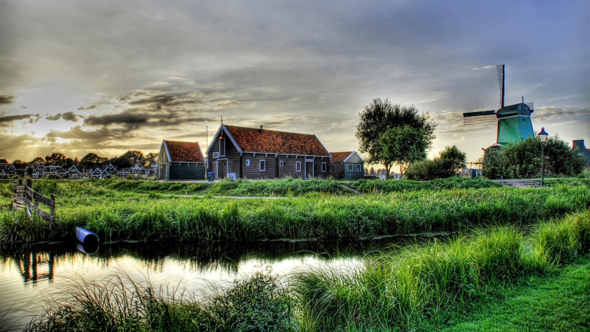 Dutch village with windmill and canal HD Wallpaper