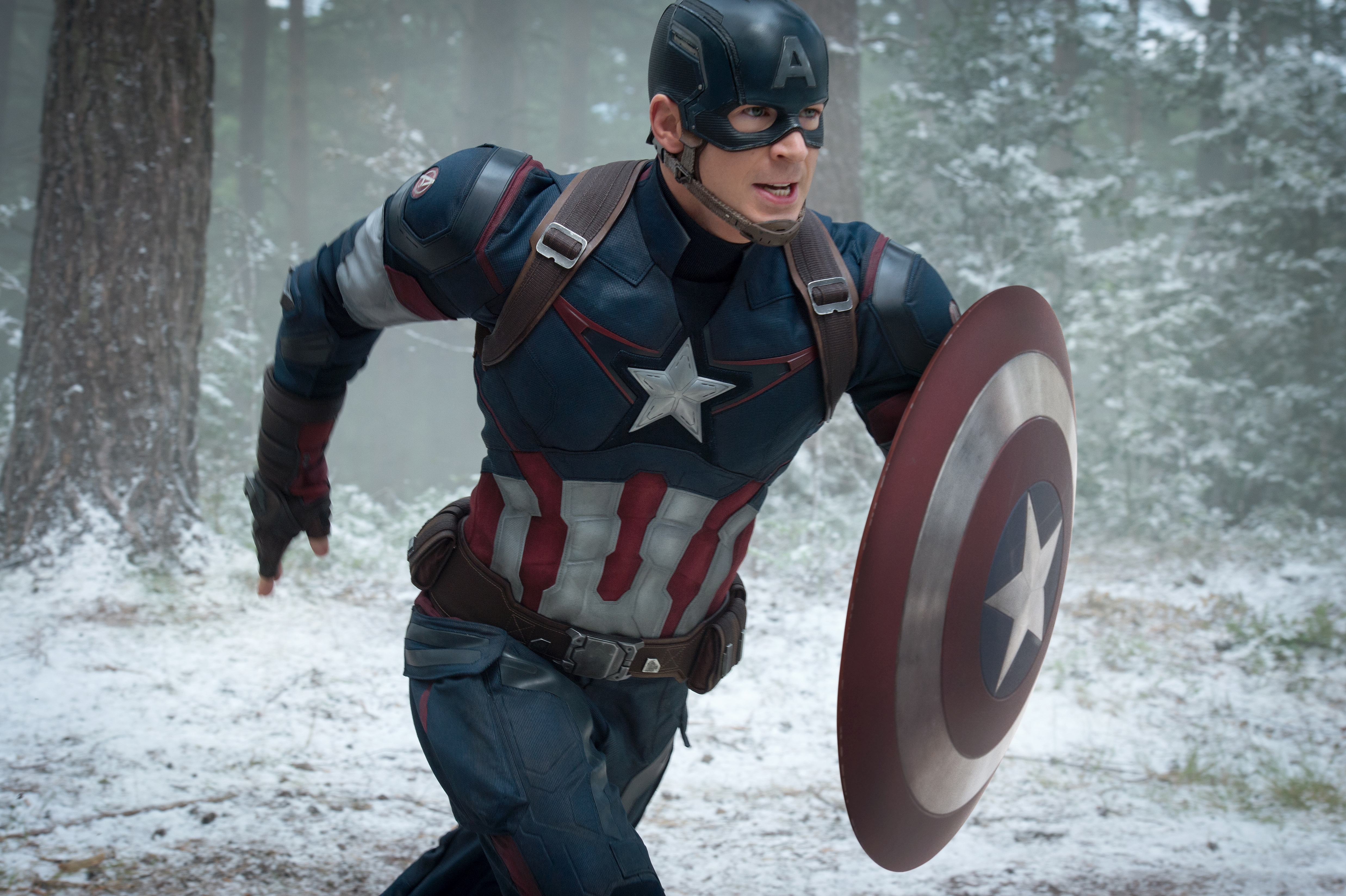 Captain America running in a snowy forest HD Wallpaper