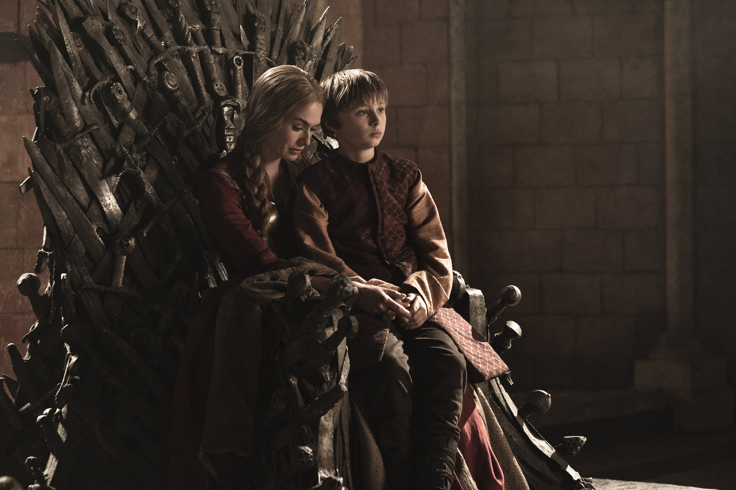 Lena Headey and boy on the Iron Throne HD Wallpaper