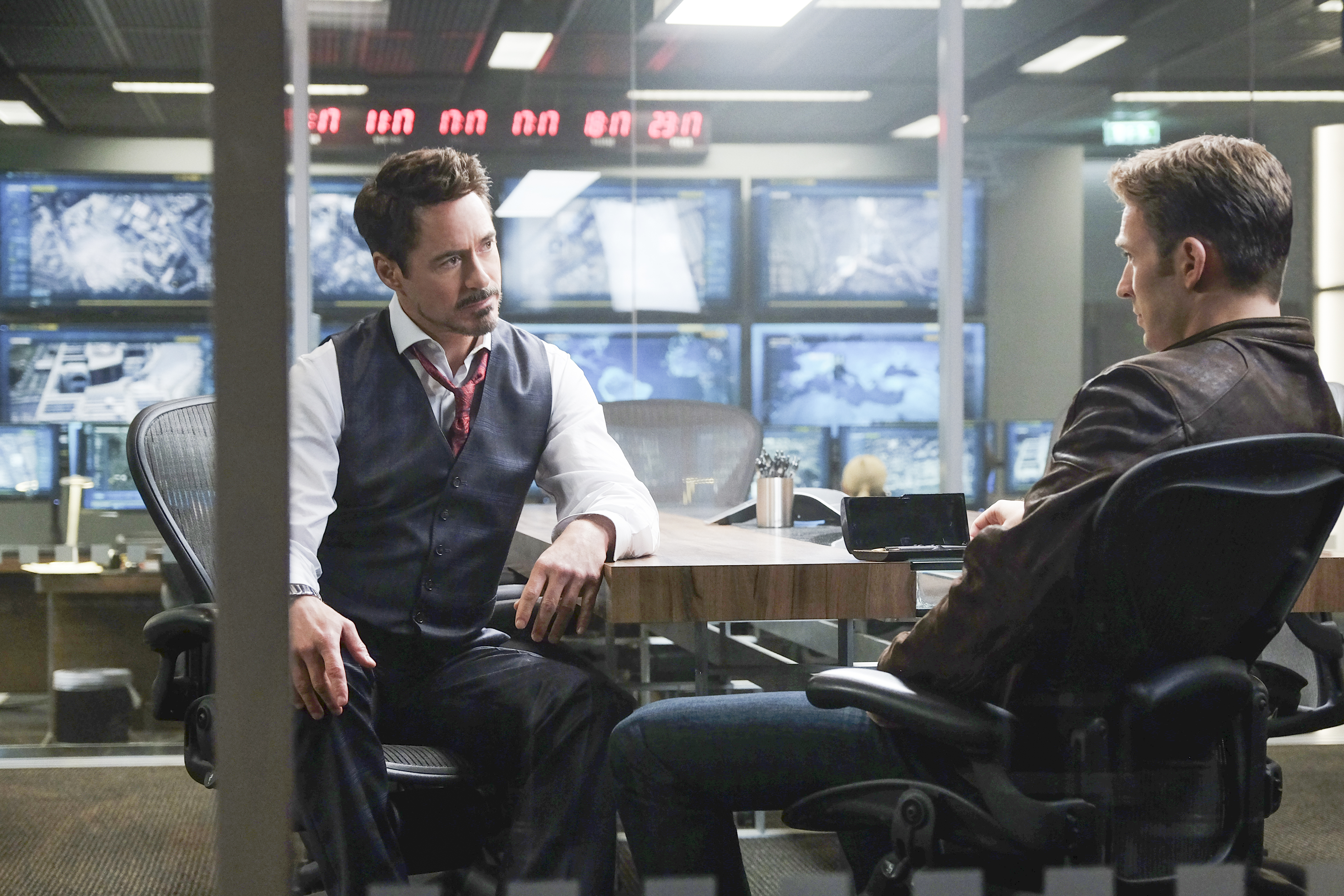 Tony Stark and Captain America in a control room HD Wallpaper