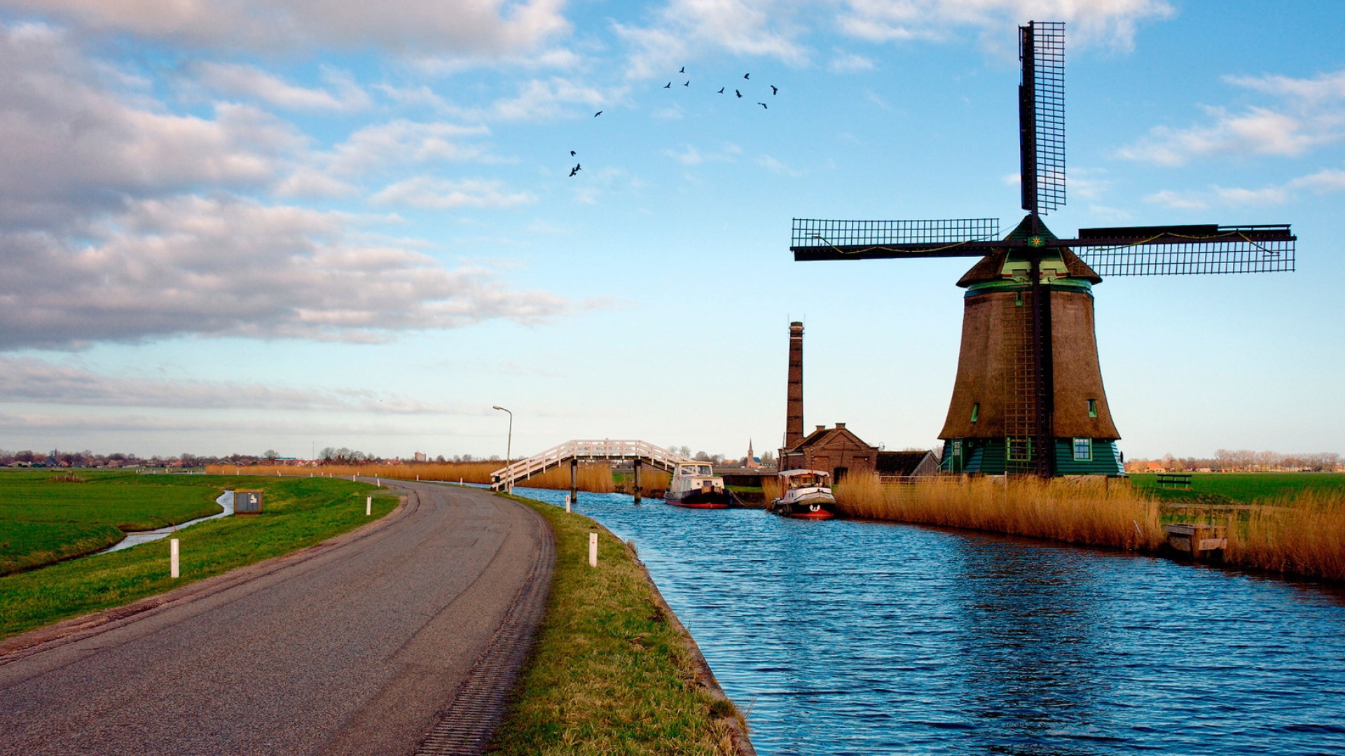 Windmill and canal with boats and bridge HD Wallpaper