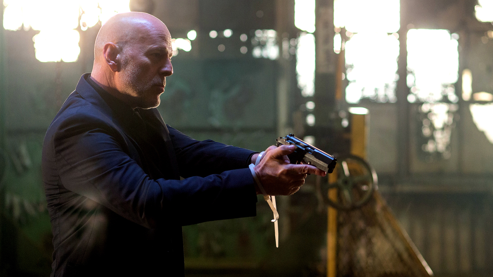 Bruce Willis holding a gun HD Wallpaper