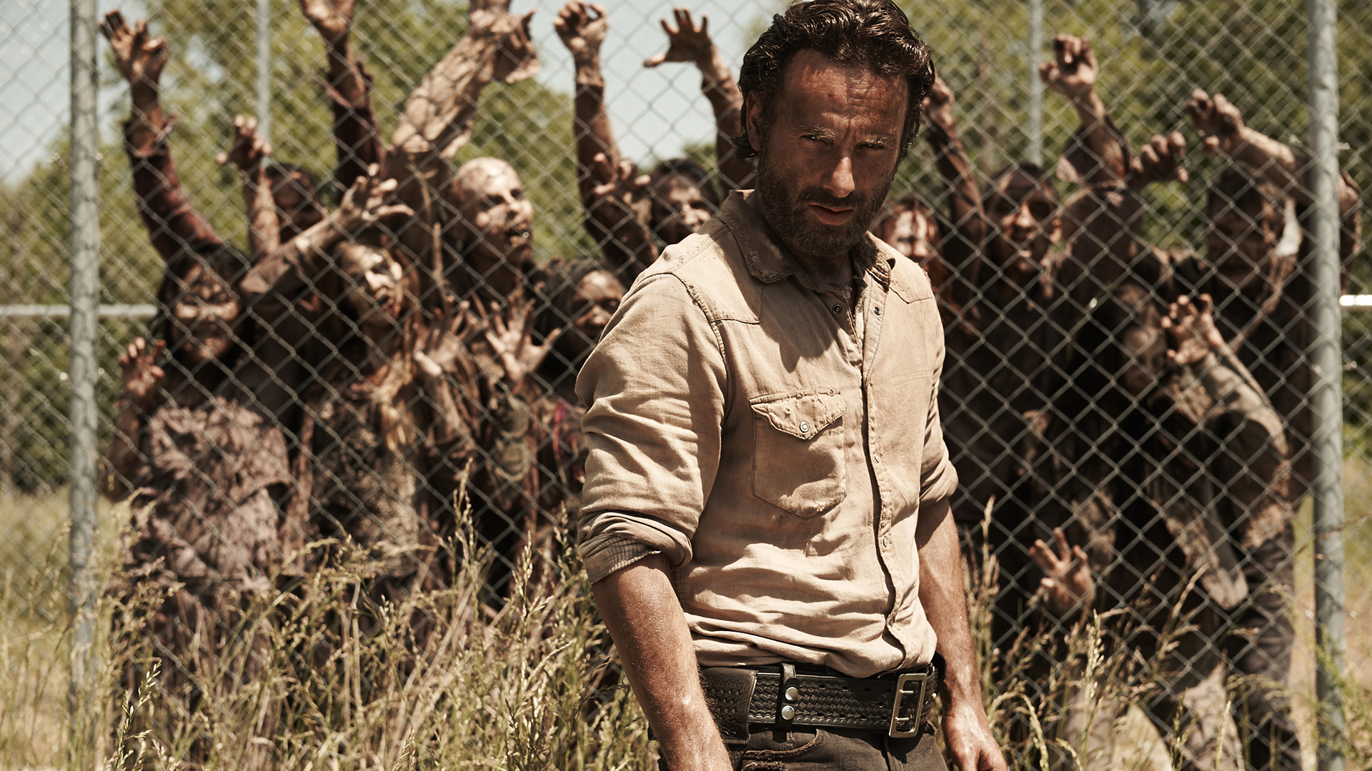 Rick Grimes from The Walking Dead surrounded by zombies HD Wallpaper