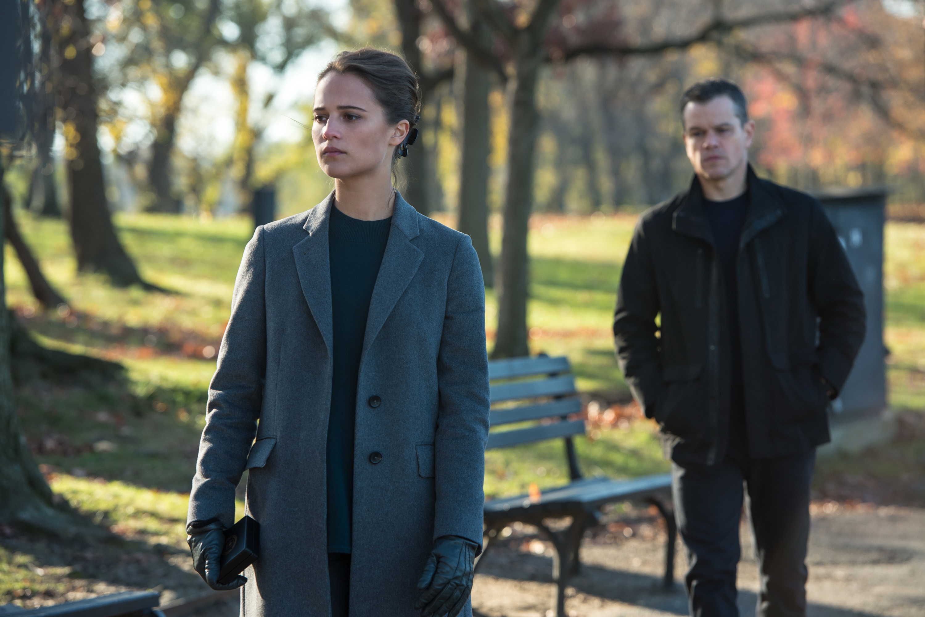Alicia Vikander and Matt Damon in a park HD Wallpaper