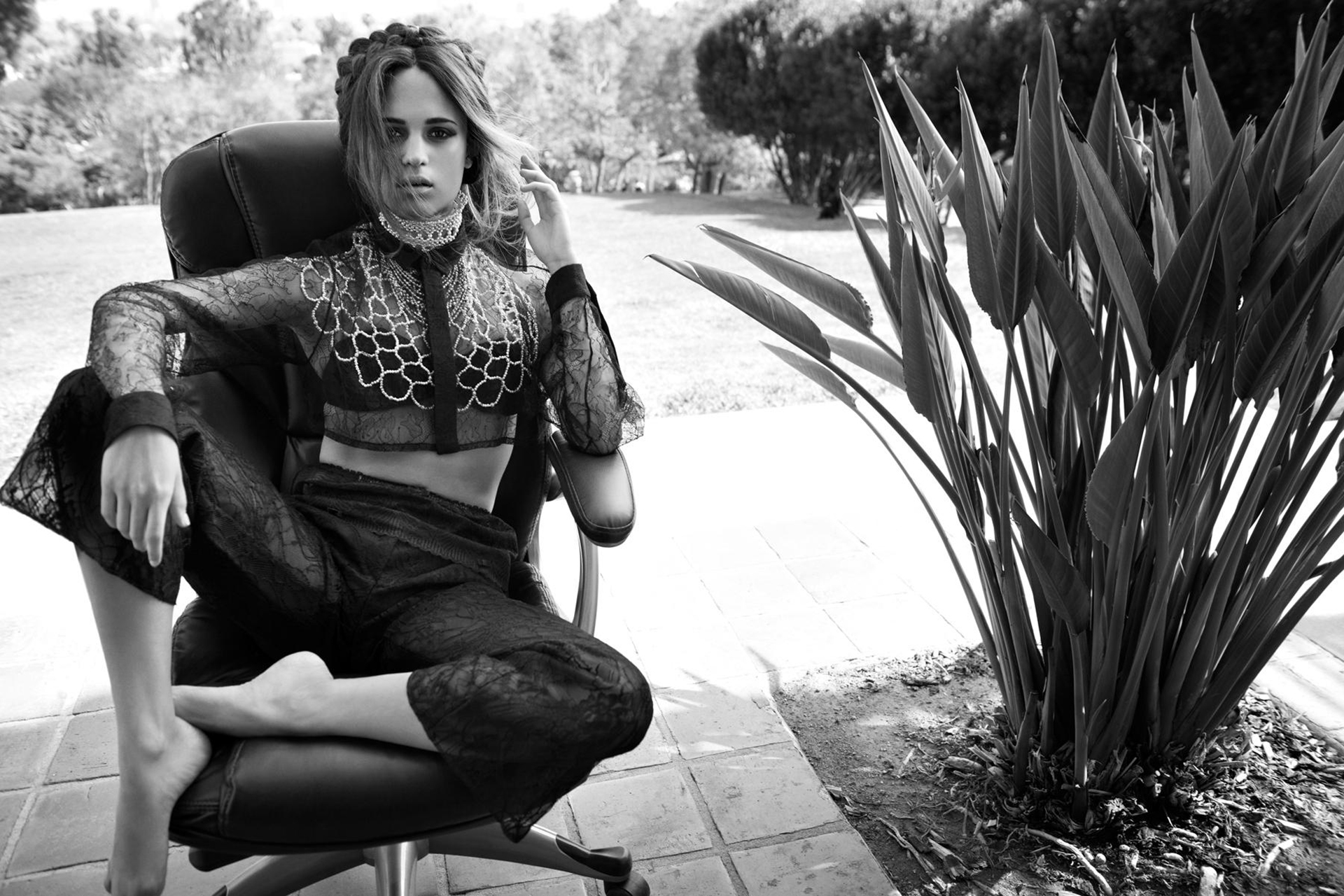 Alicia Vikander sitting in a chair outdoors HD Wallpaper