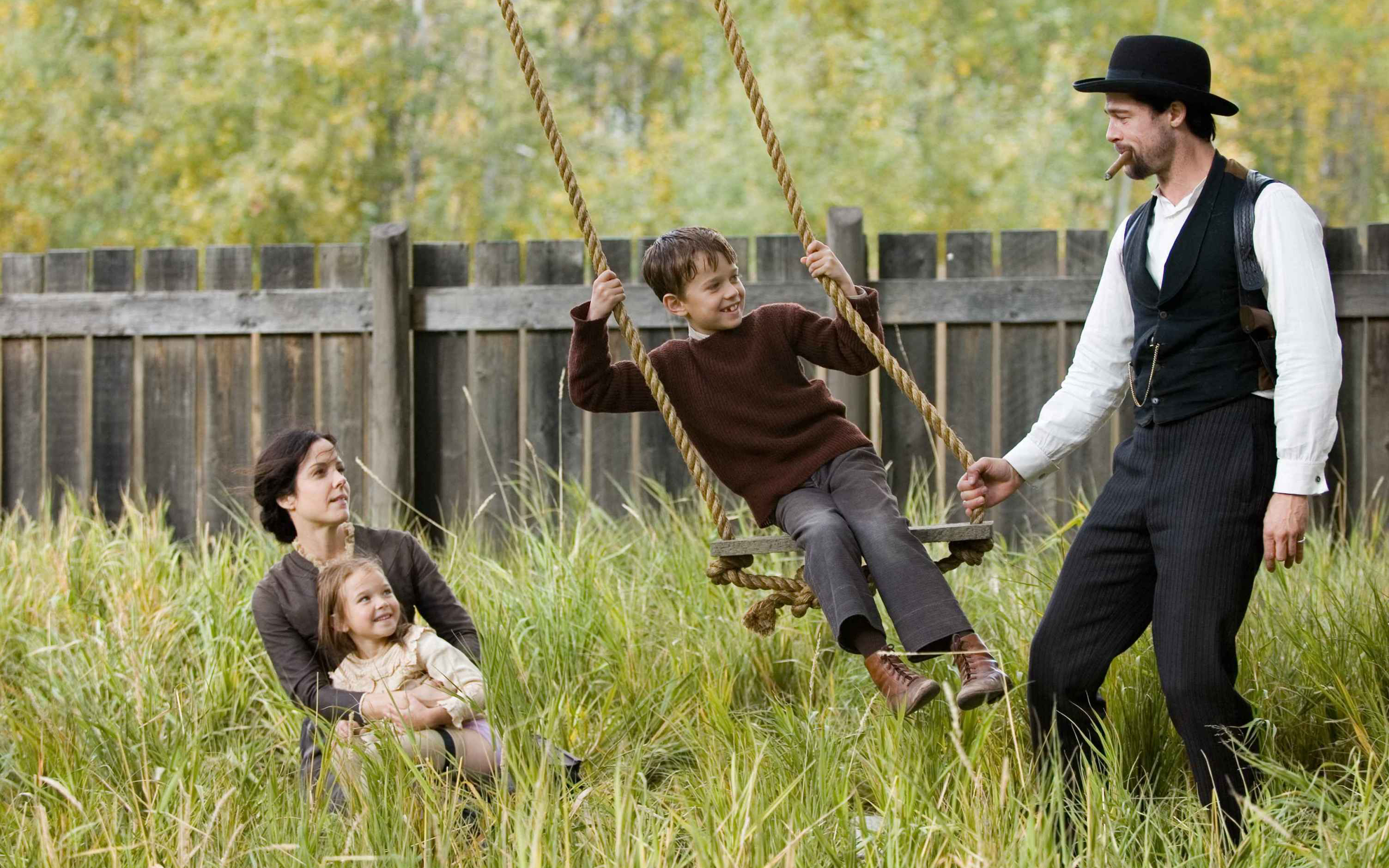 Brad Pitt with family on a swing HD Wallpaper