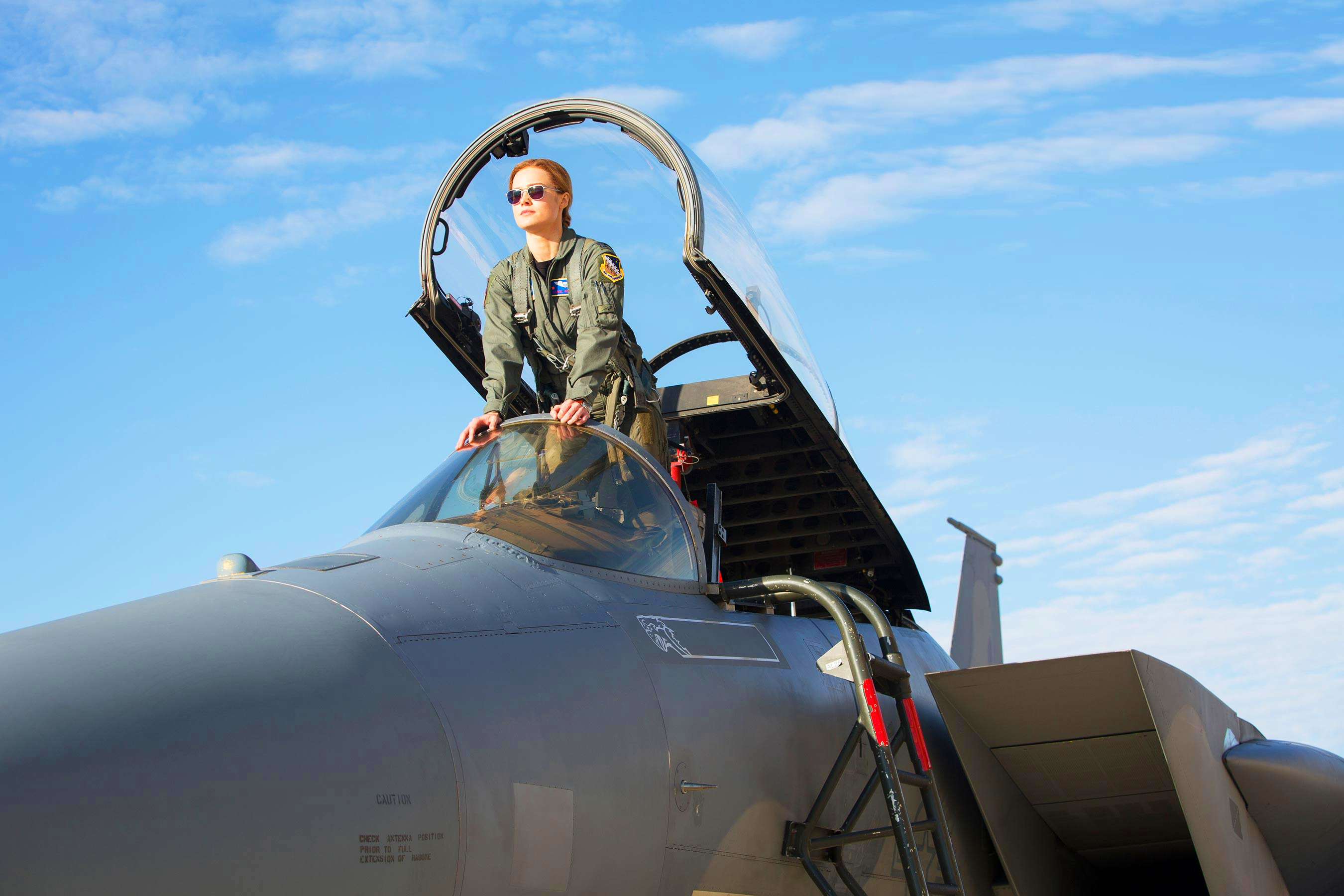 Brie Larson as Captain Marvel in a fighter jet HD Wallpaper