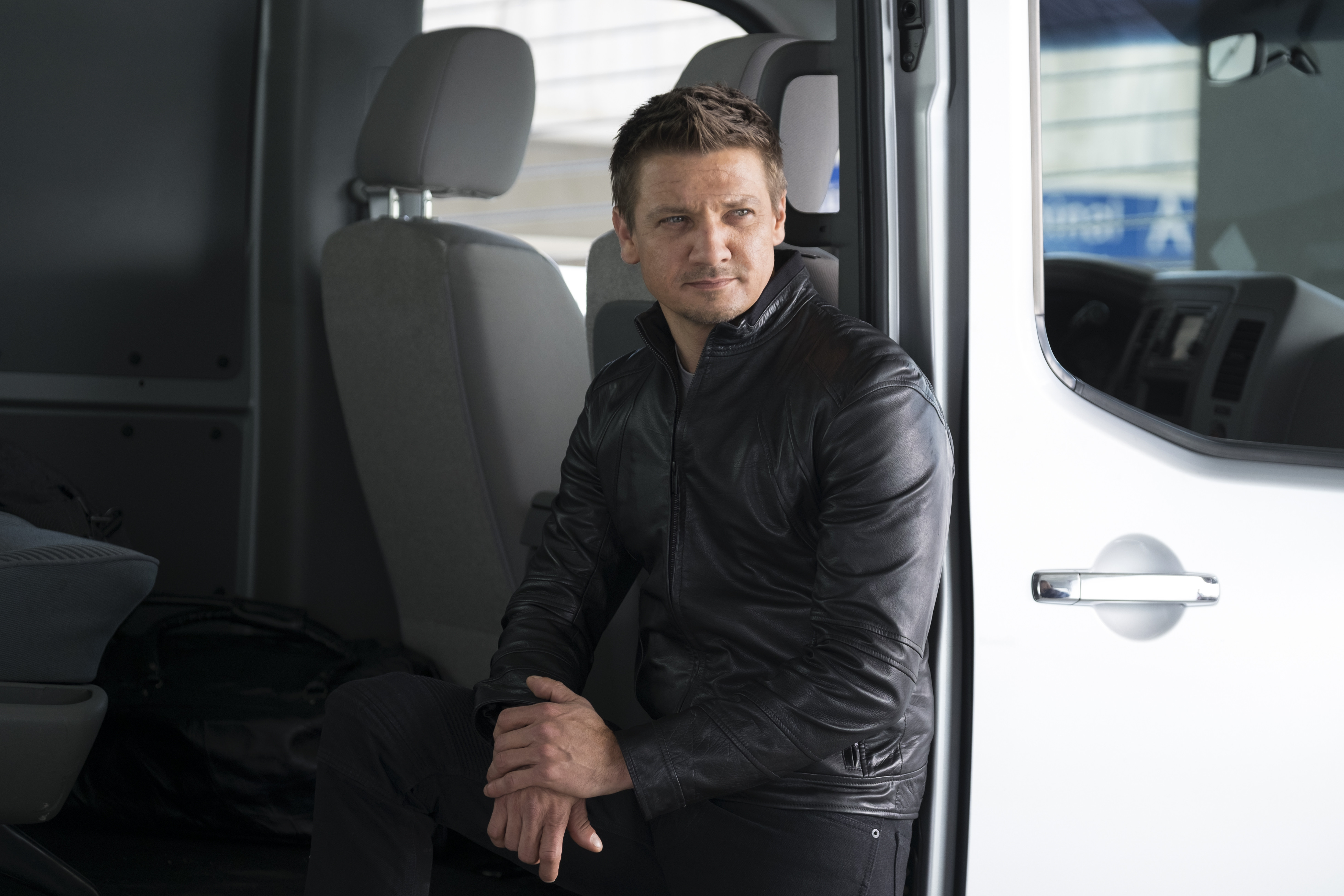 Jeremy Renner in a van HD Wallpaper