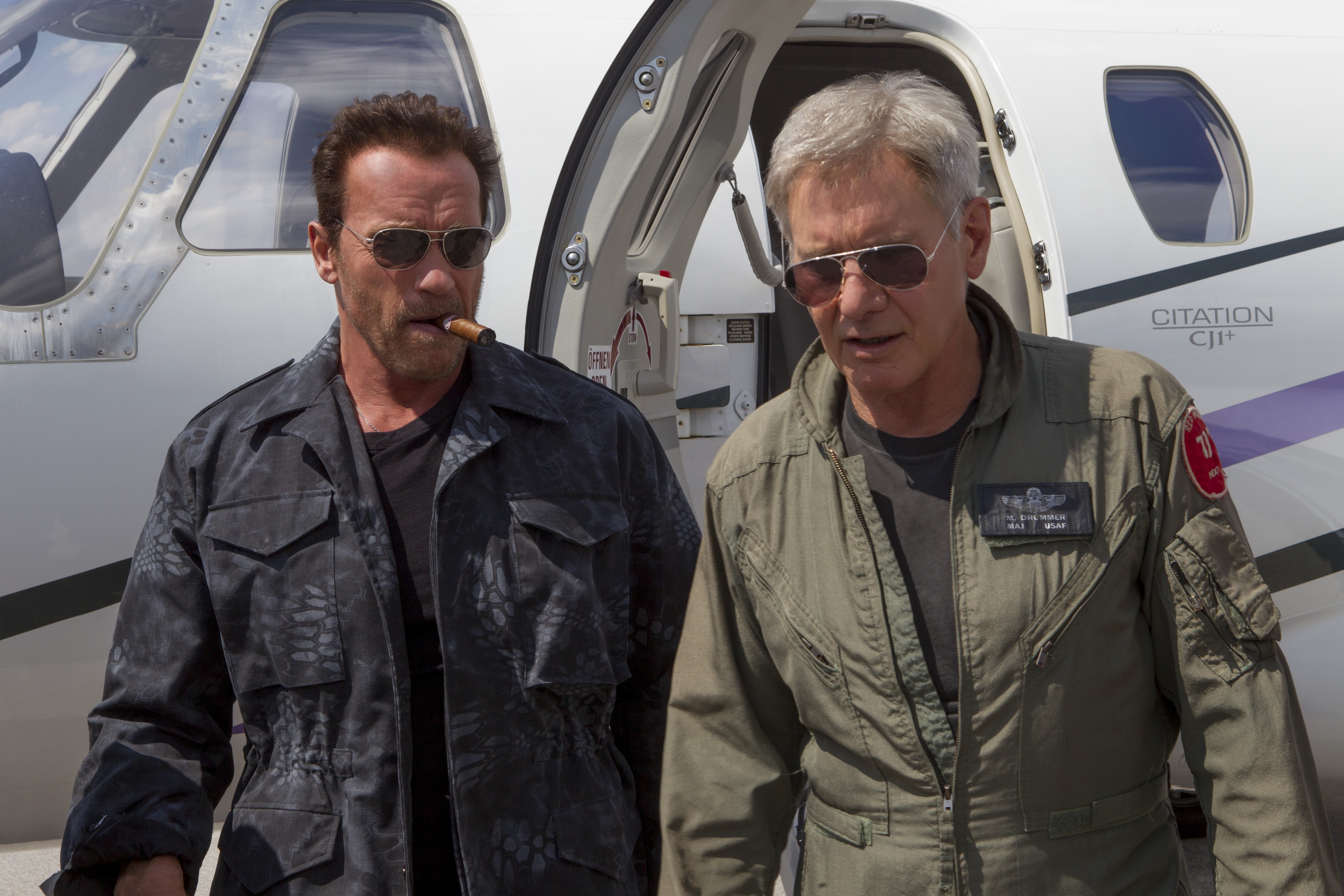 Arnold Schwarzenegger and Harrison Ford by a Citation CJ1+ jet HD Wallpaper