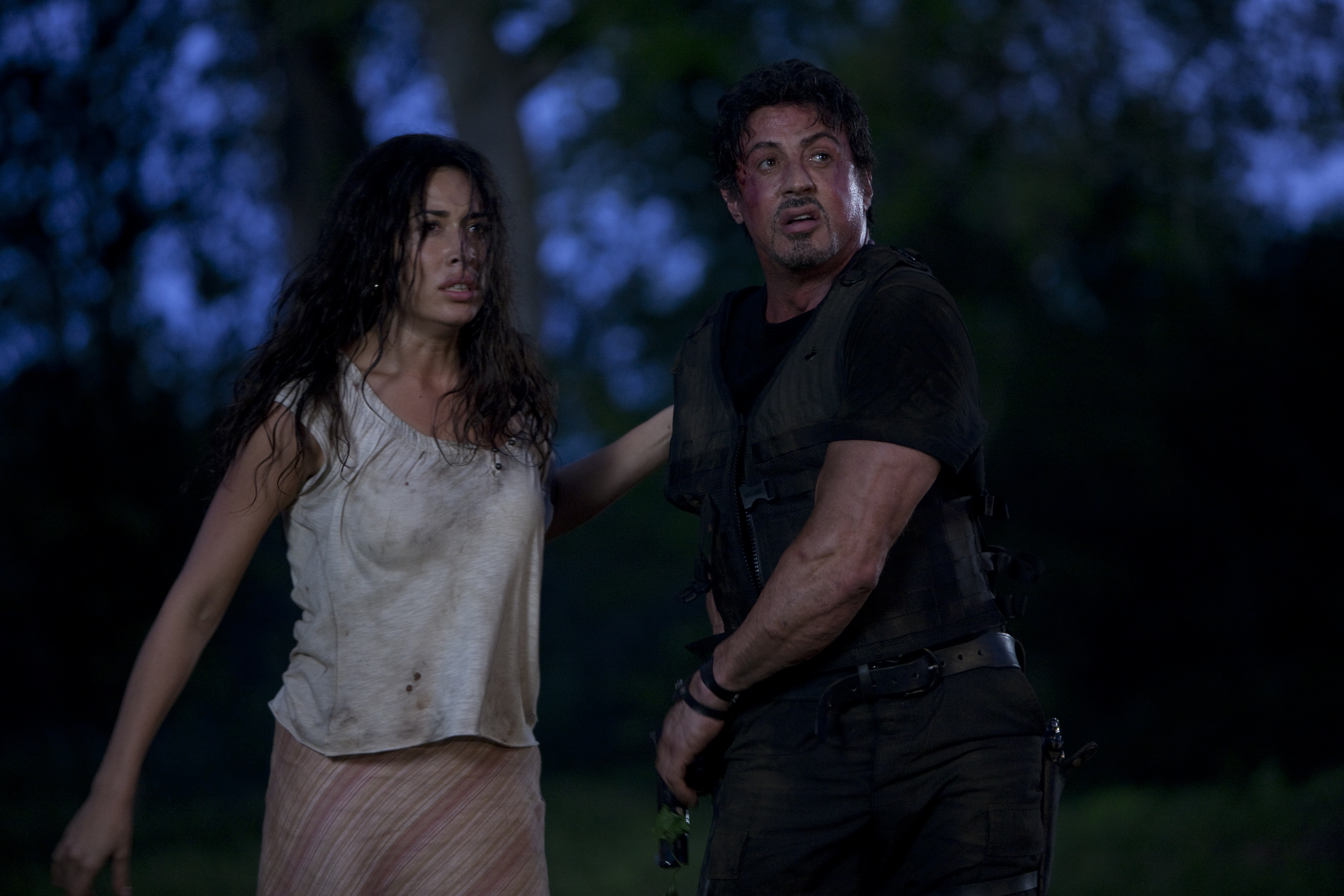 Sylvester Stallone and a woman in a forest HD Wallpaper