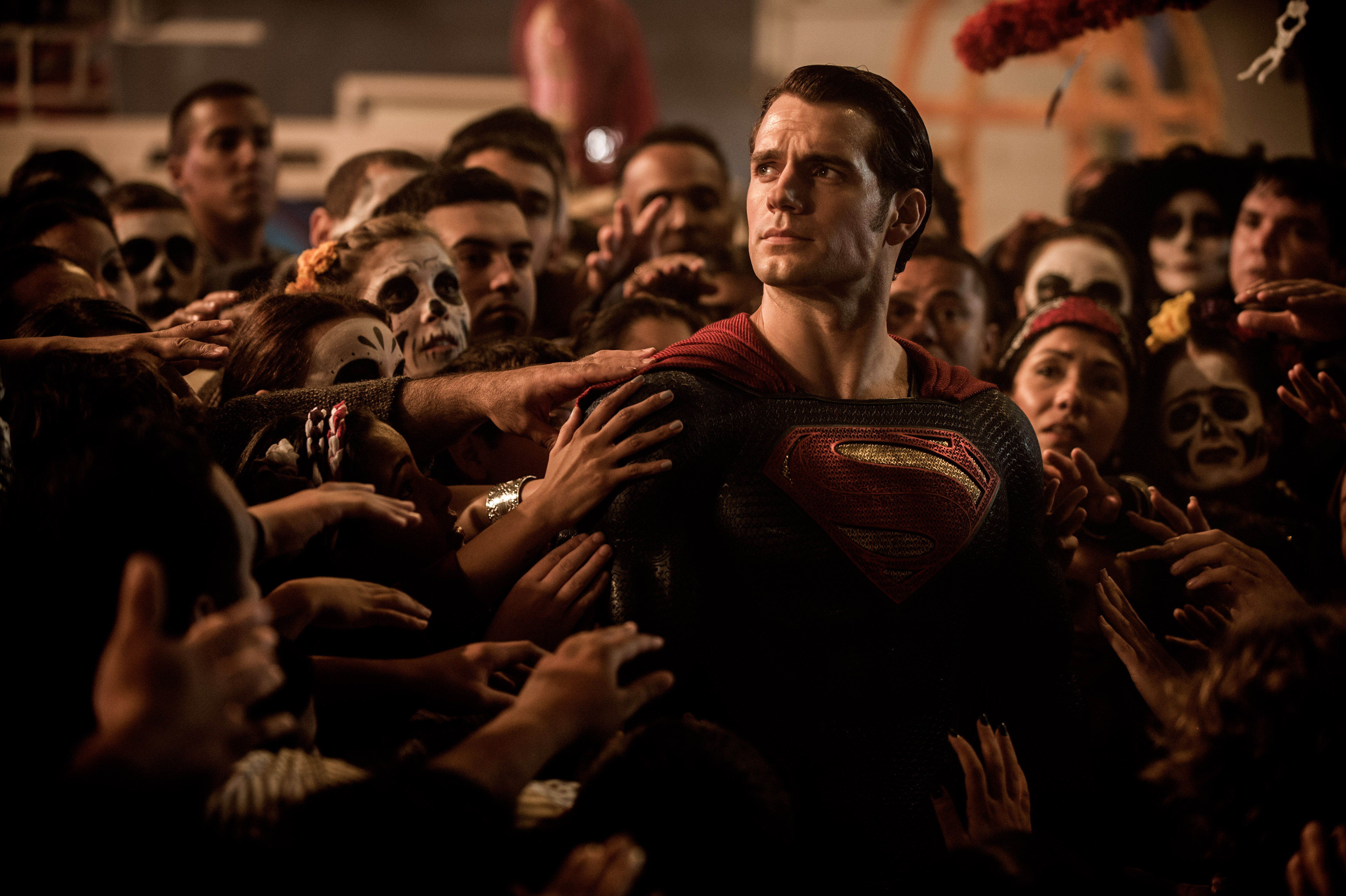 Superman surrounded by people with skull makeup HD Wallpaper