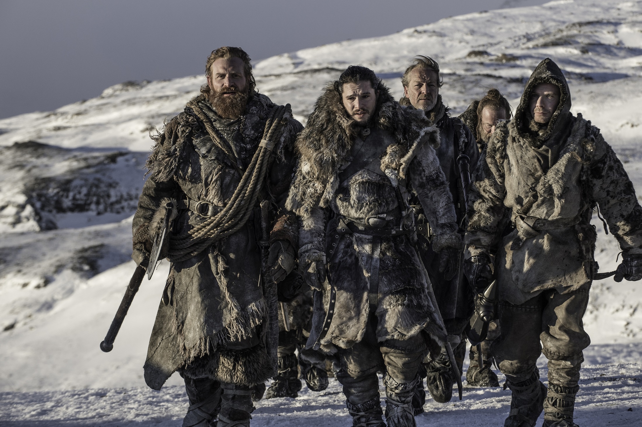Group of men in furs in a snowy landscape HD Wallpaper