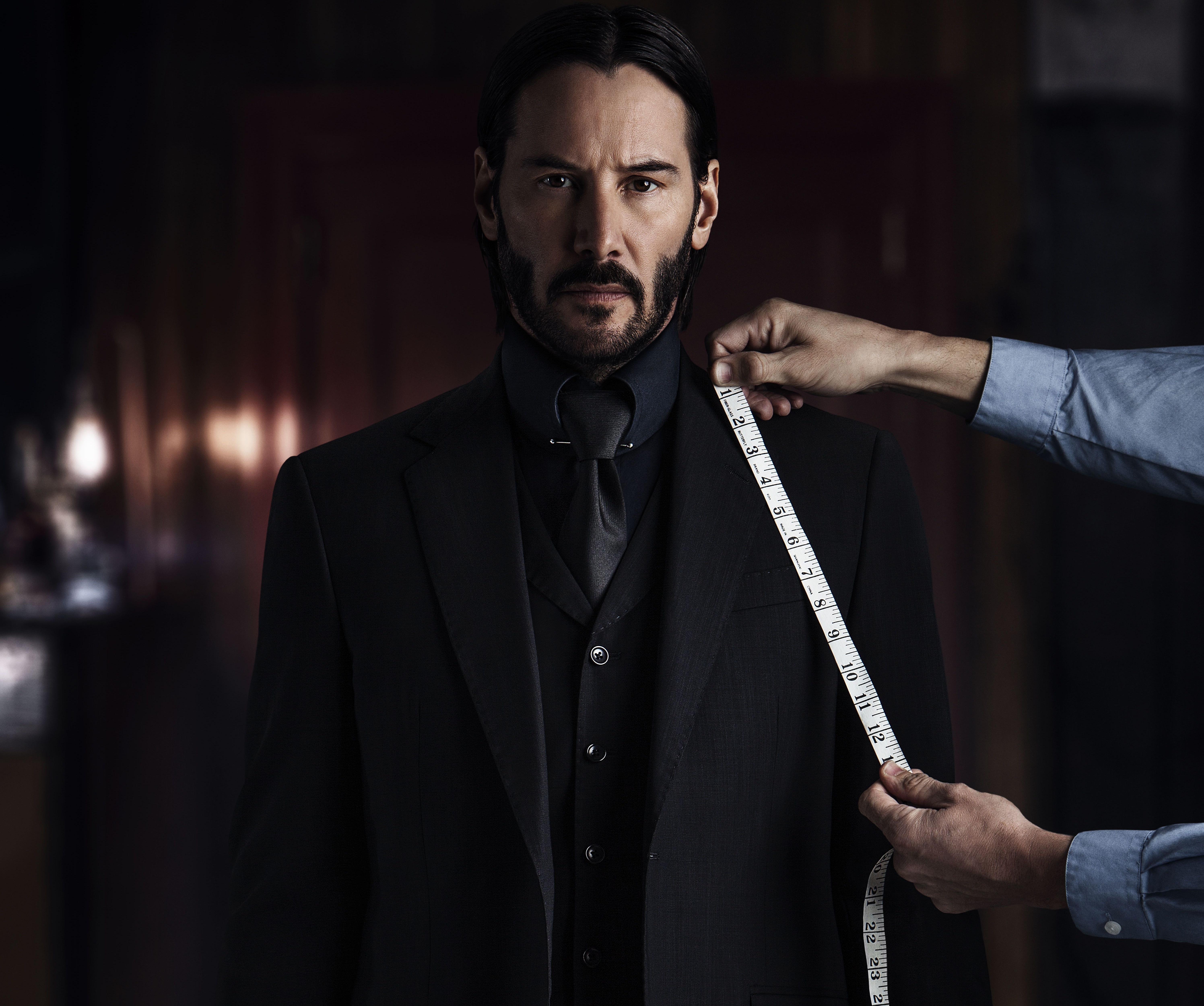 Keanu Reeves being measured for a suit HD Wallpaper