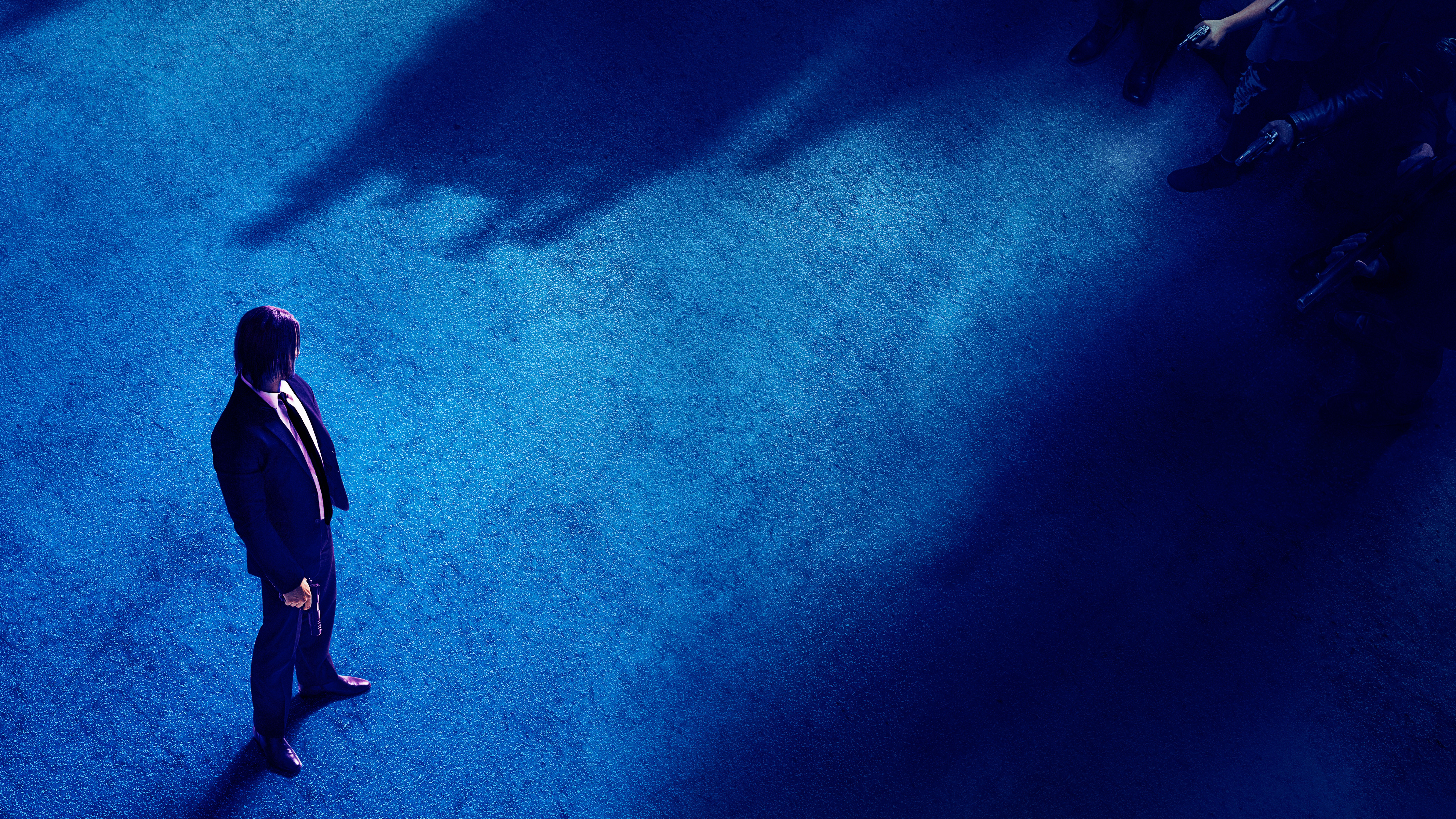 Keanu Reeves in a suit on a blue carpet HD Wallpaper
