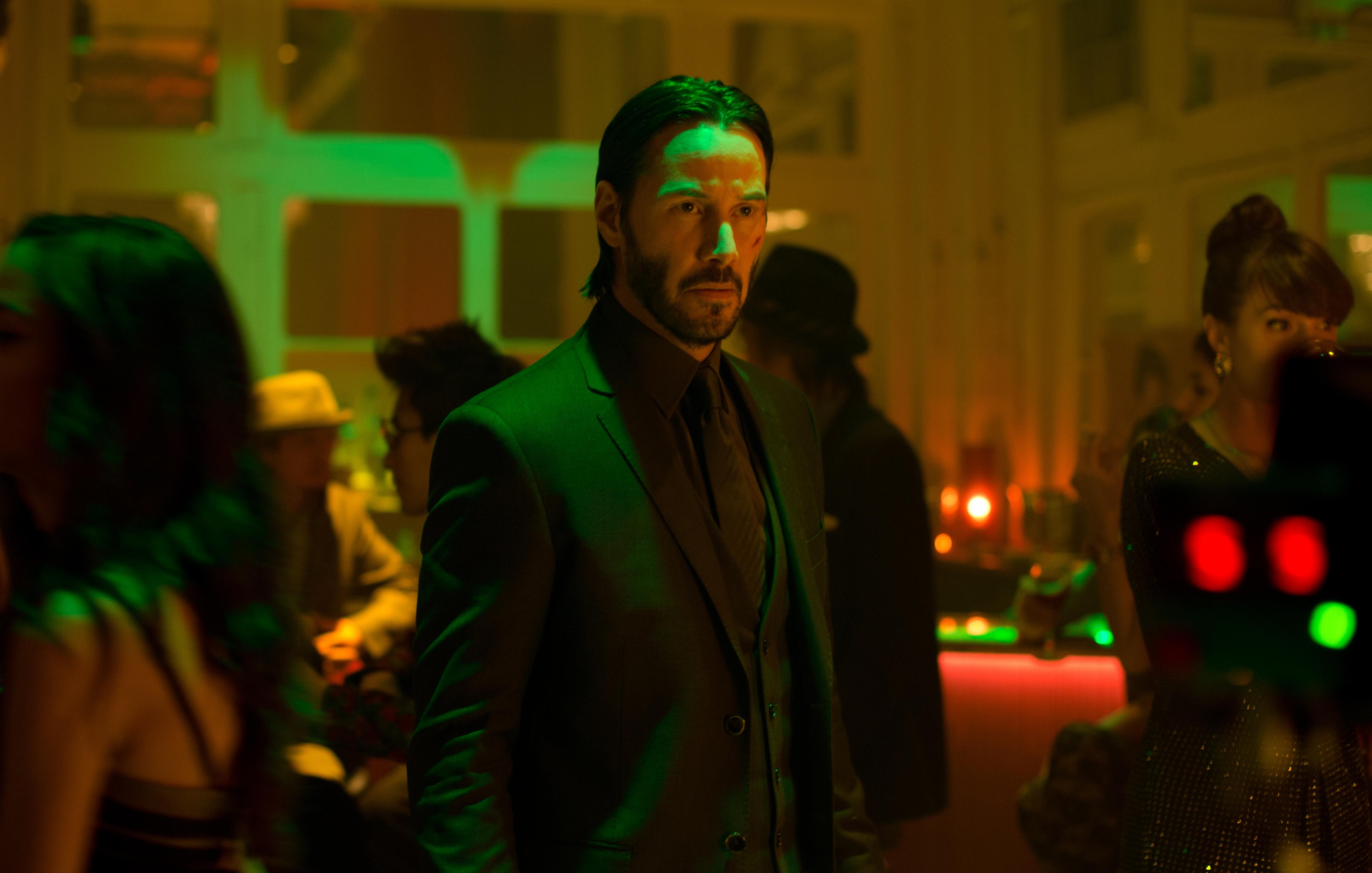 Keanu Reeves in a dark suit HD Wallpaper