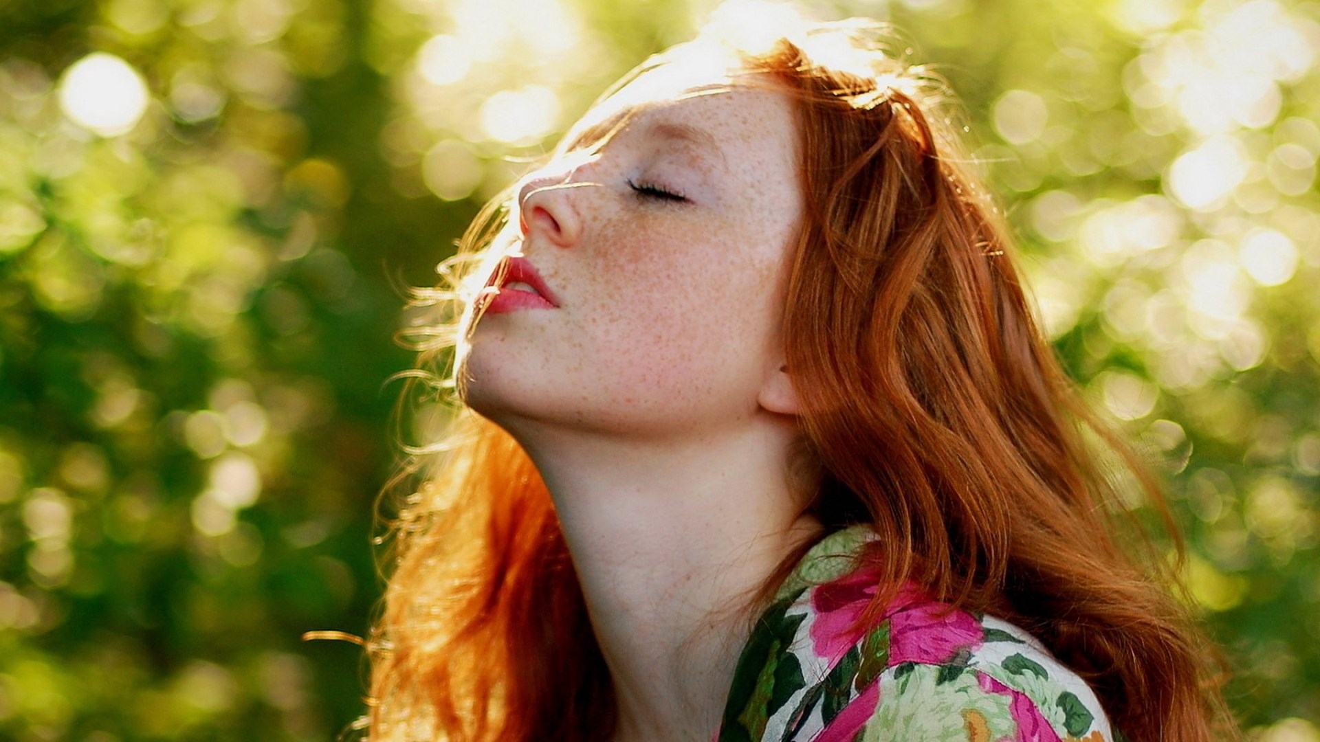 Young woman with red hair and freckles in sunlight HD Wallpaper
