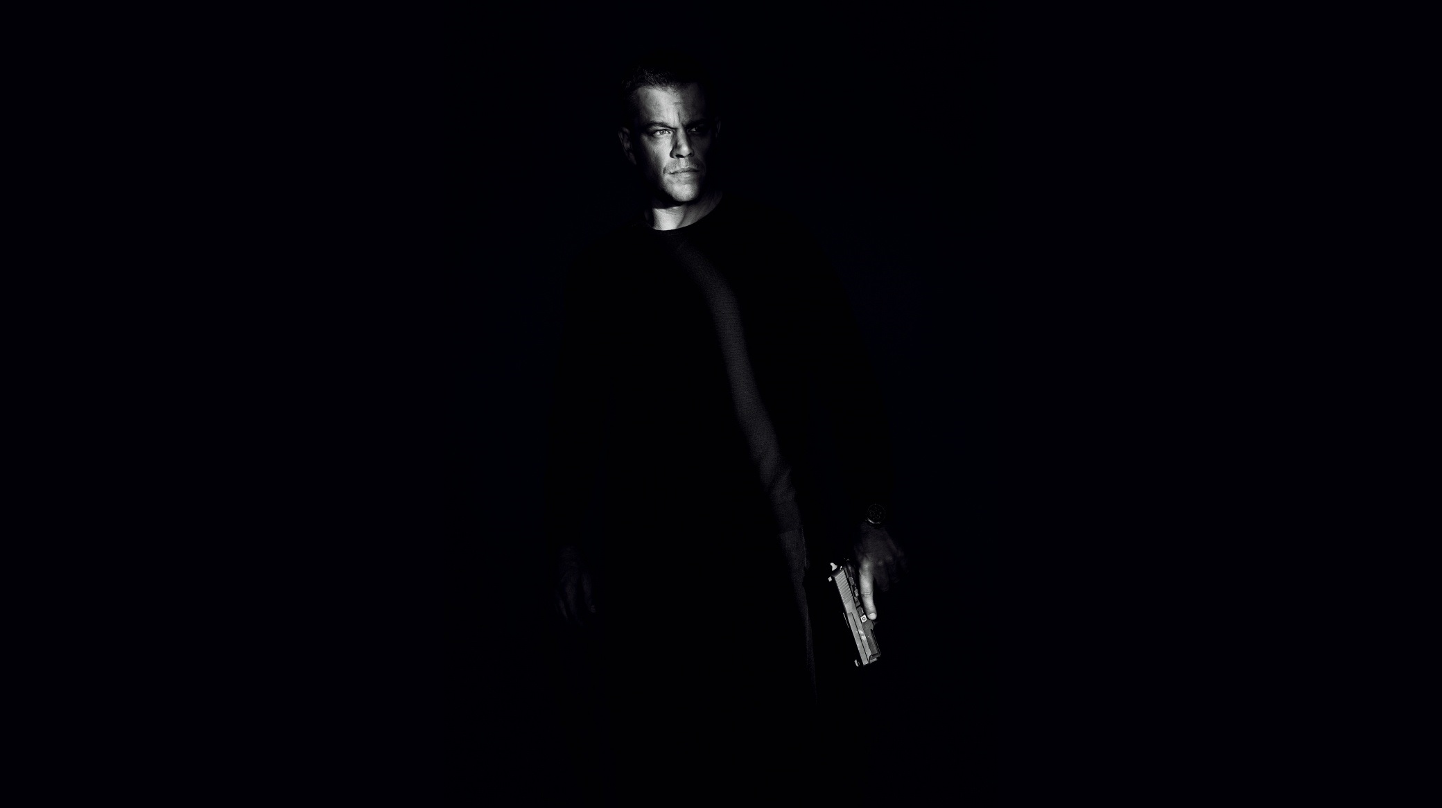 Matt Damon holding a gun HD Wallpaper