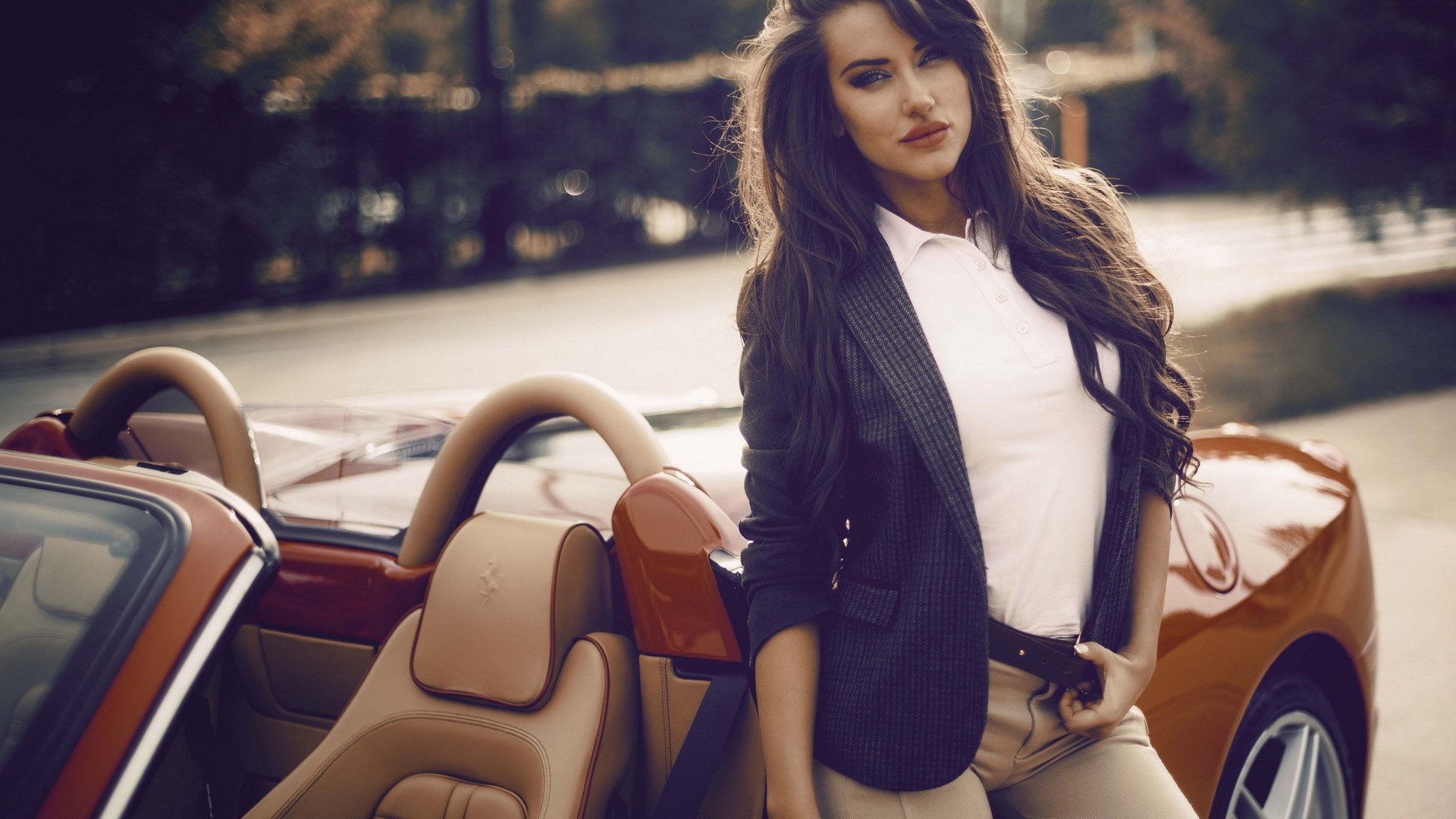 Woman in blazer leaning on a red convertible car HD Wallpaper