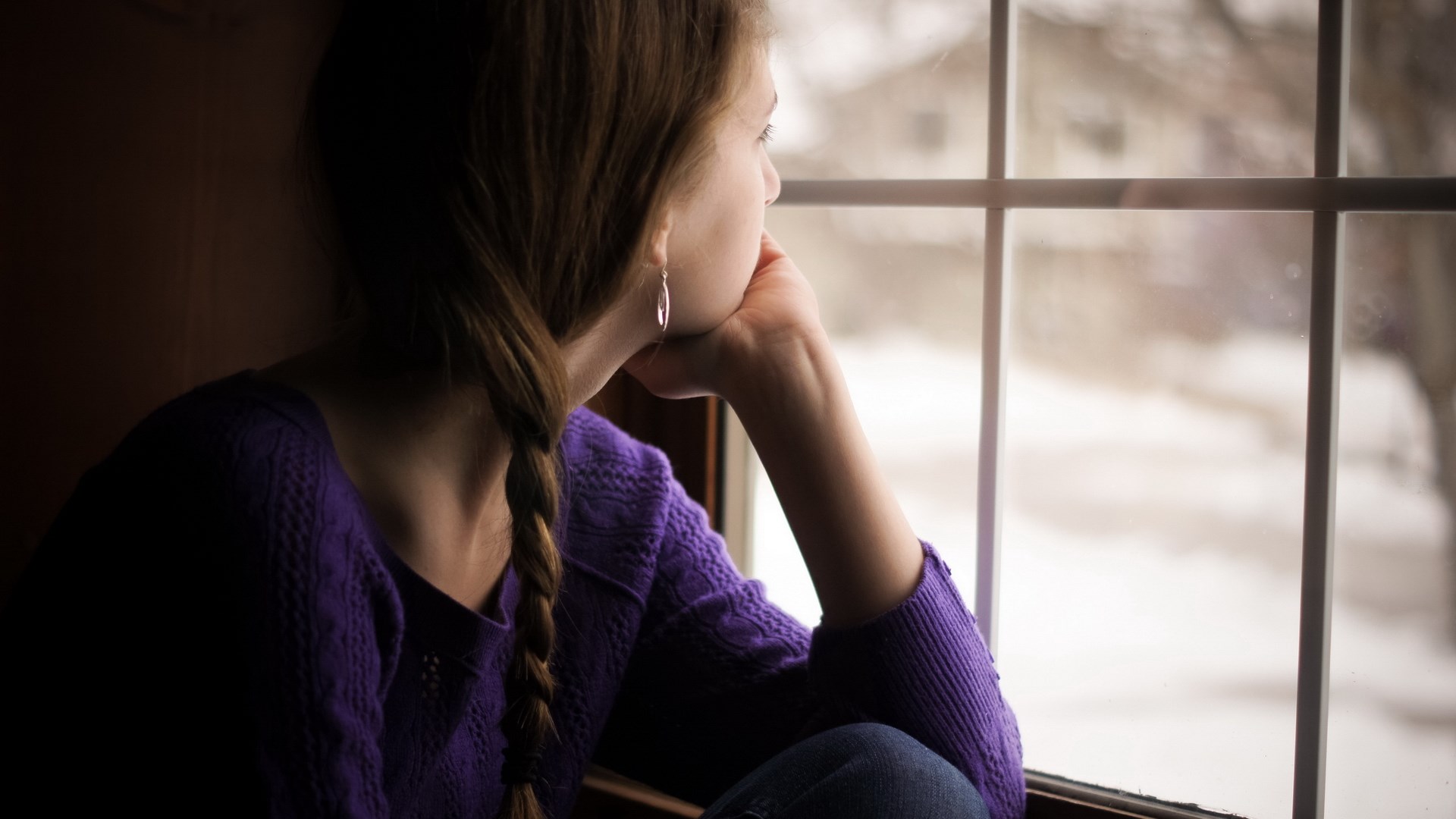 Girl looking out a window HD Wallpaper