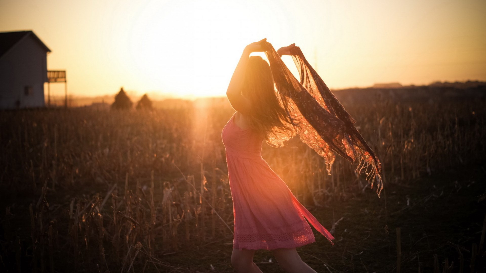 Woman in pink dress with scarf at sunset HD Wallpaper