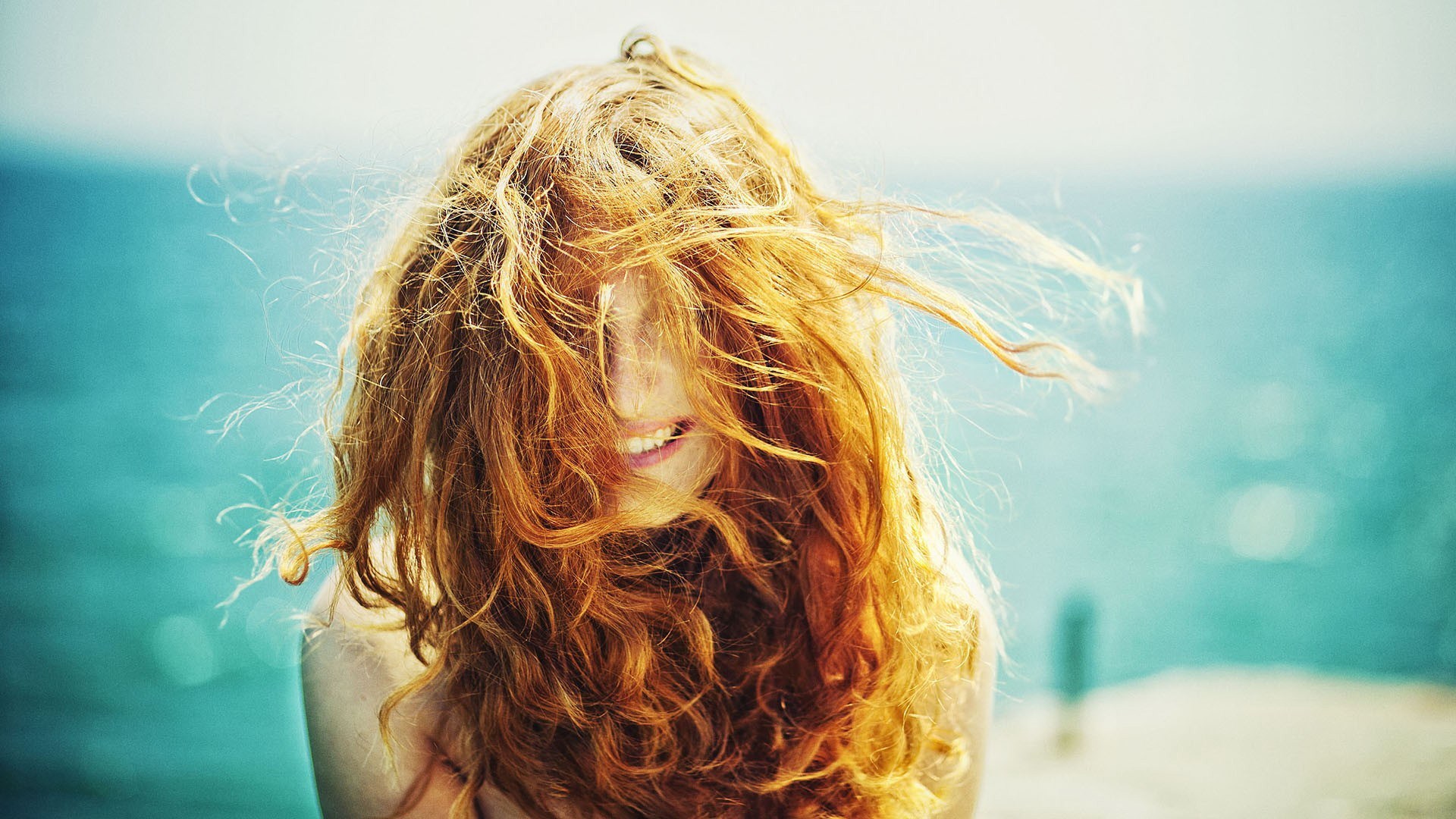 Woman with red hair by the ocean HD Wallpaper