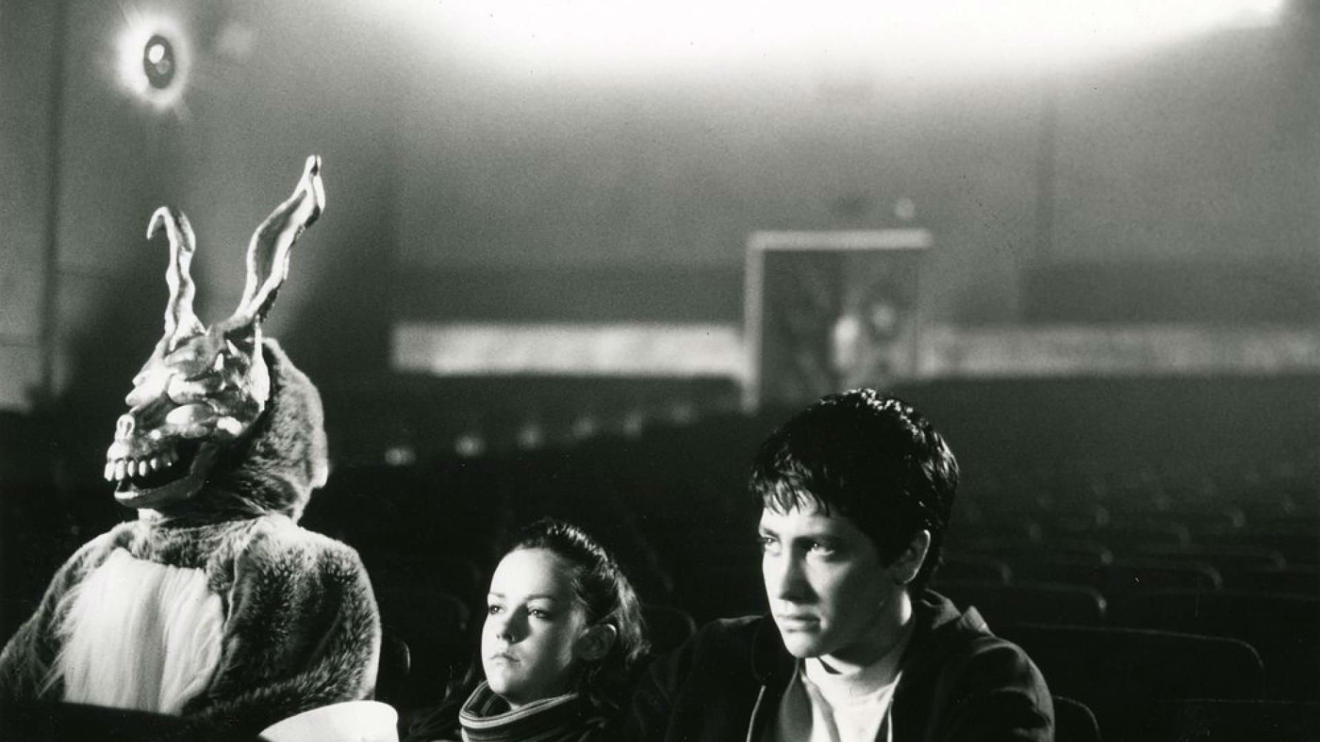 Donnie Darko: Frank the Rabbit and Jake Gyllenhaal in theater HD Wallpaper