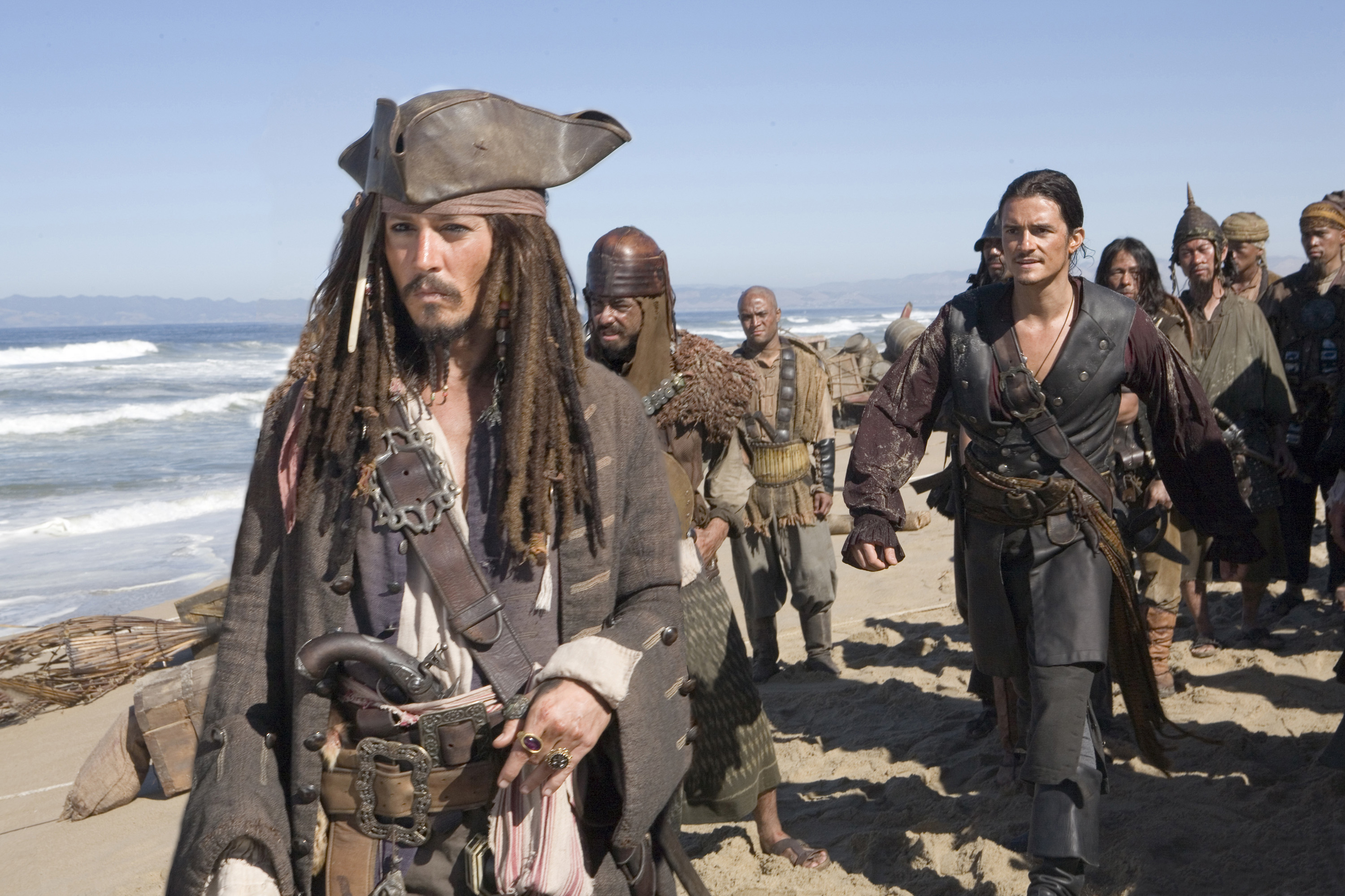 Captain Jack Sparrow and Will Turner from Pirates of the Caribbean on a beach HD Wallpaper