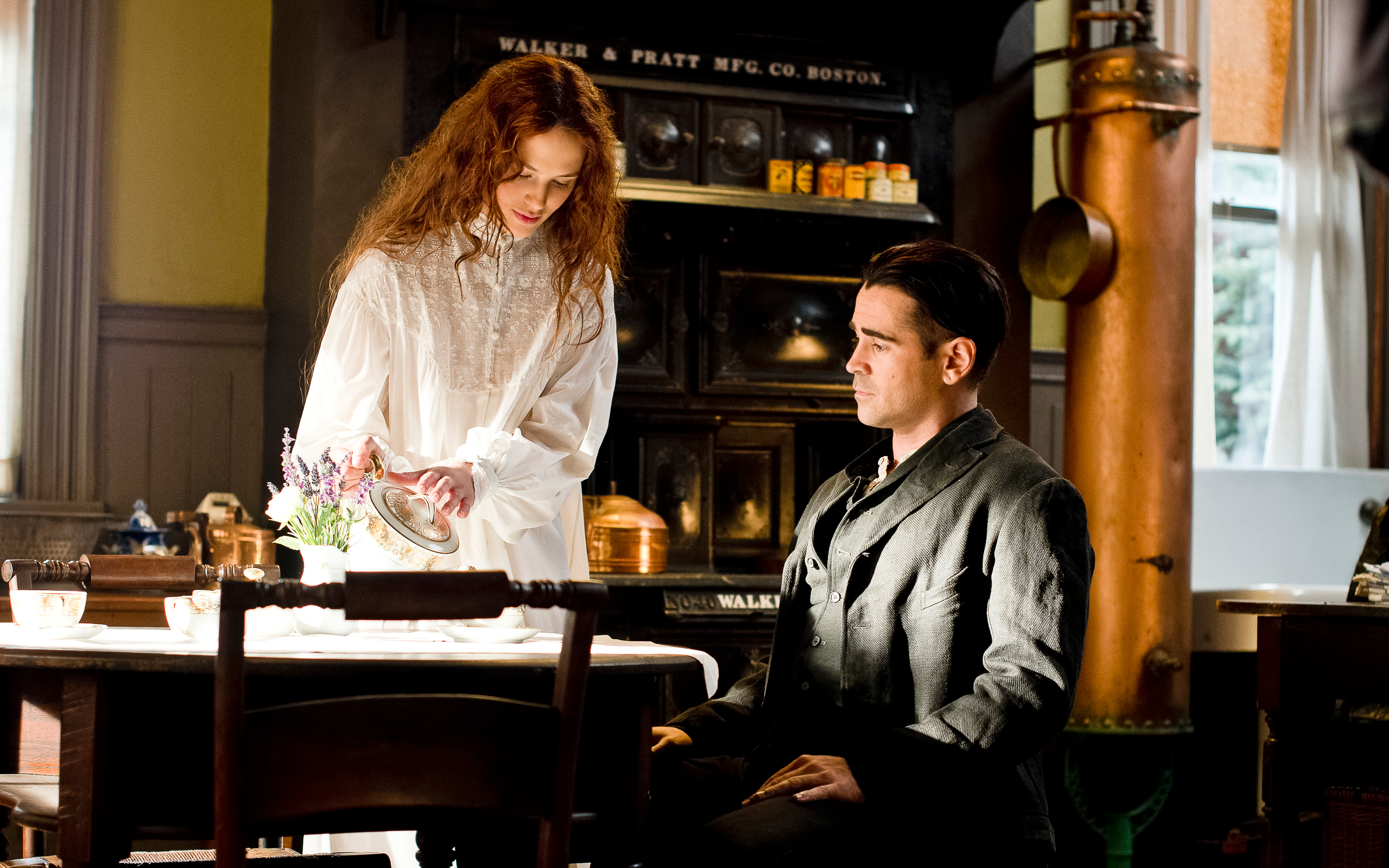 Colin Farrell and a woman in a kitchen HD Wallpaper