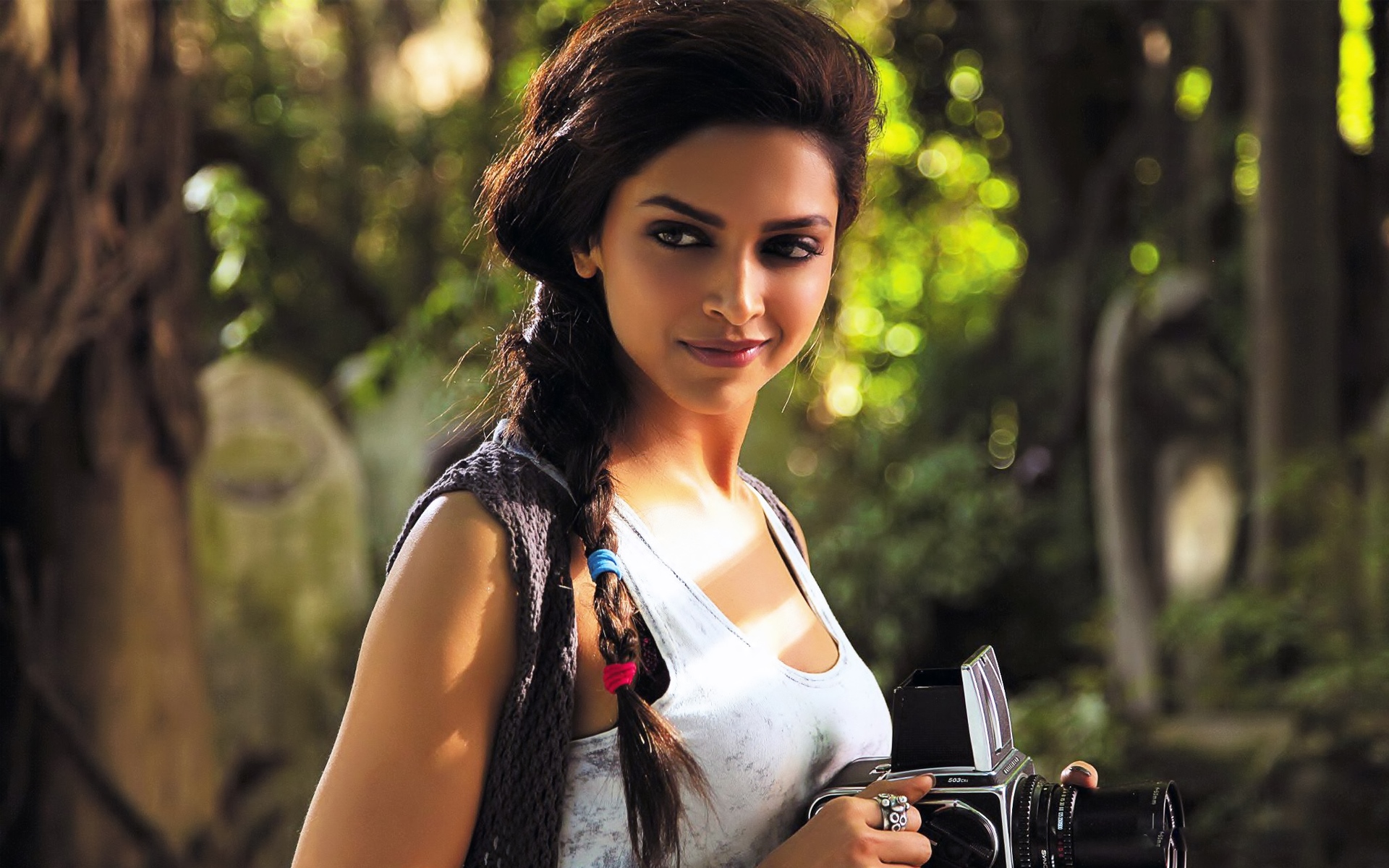 Deepika Padukone with a camera HD Wallpaper