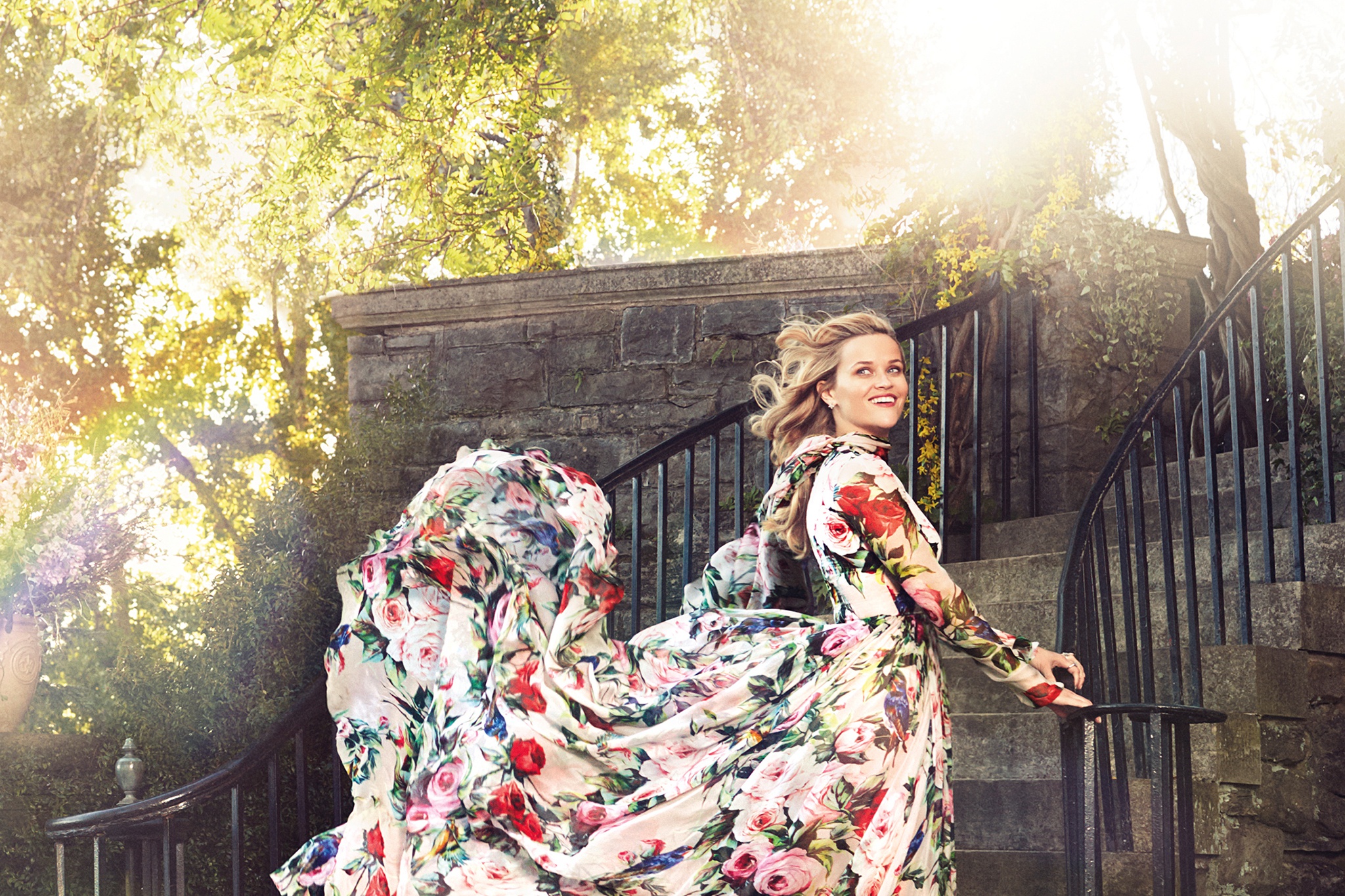 Reese Witherspoon in a floral dress on stairs HD Wallpaper
