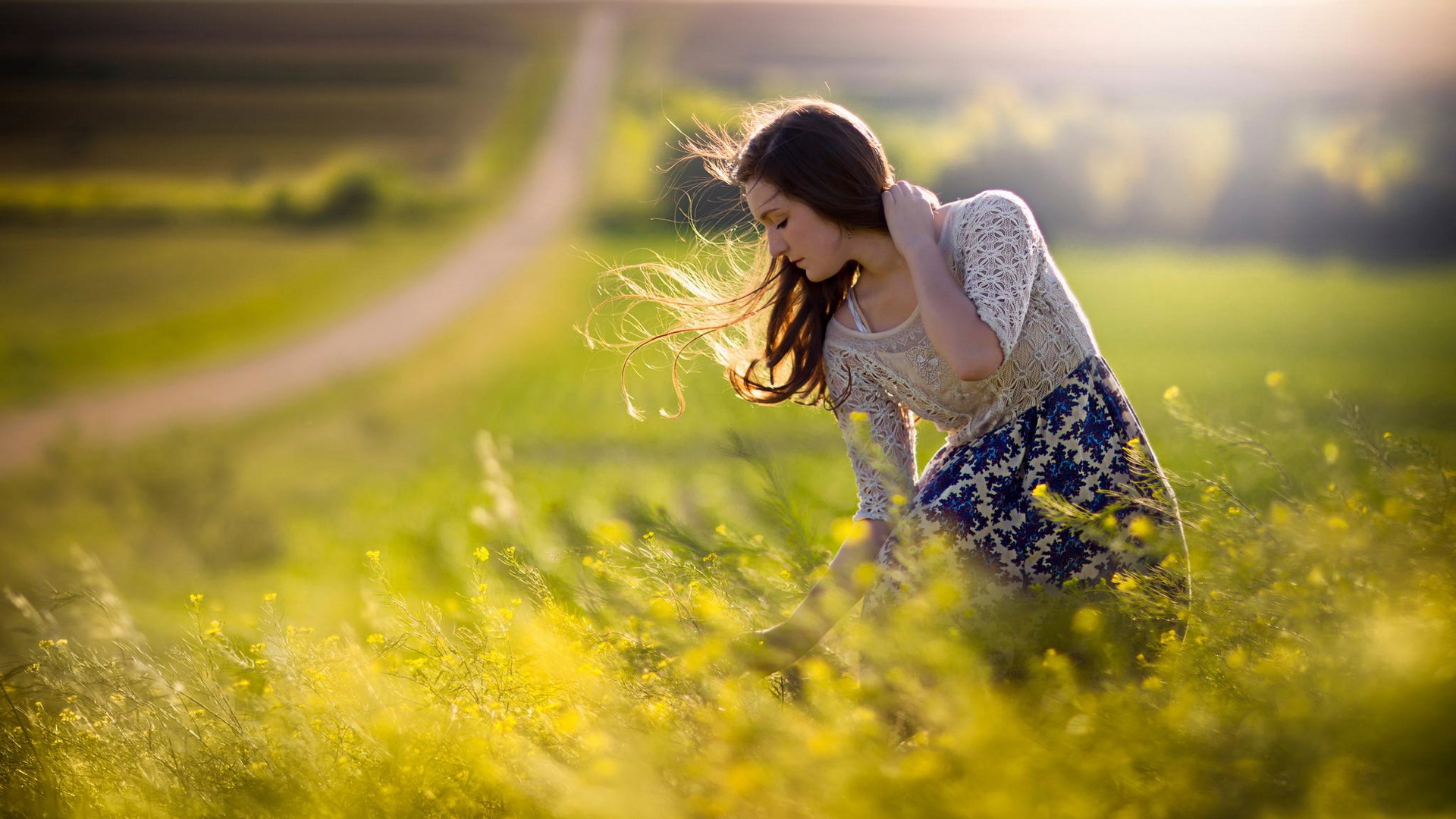Girl in a field of yellow flowers HD Wallpaper