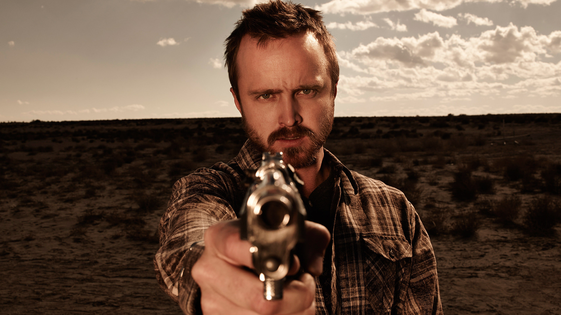 Aaron Paul holding a gun HD Wallpaper