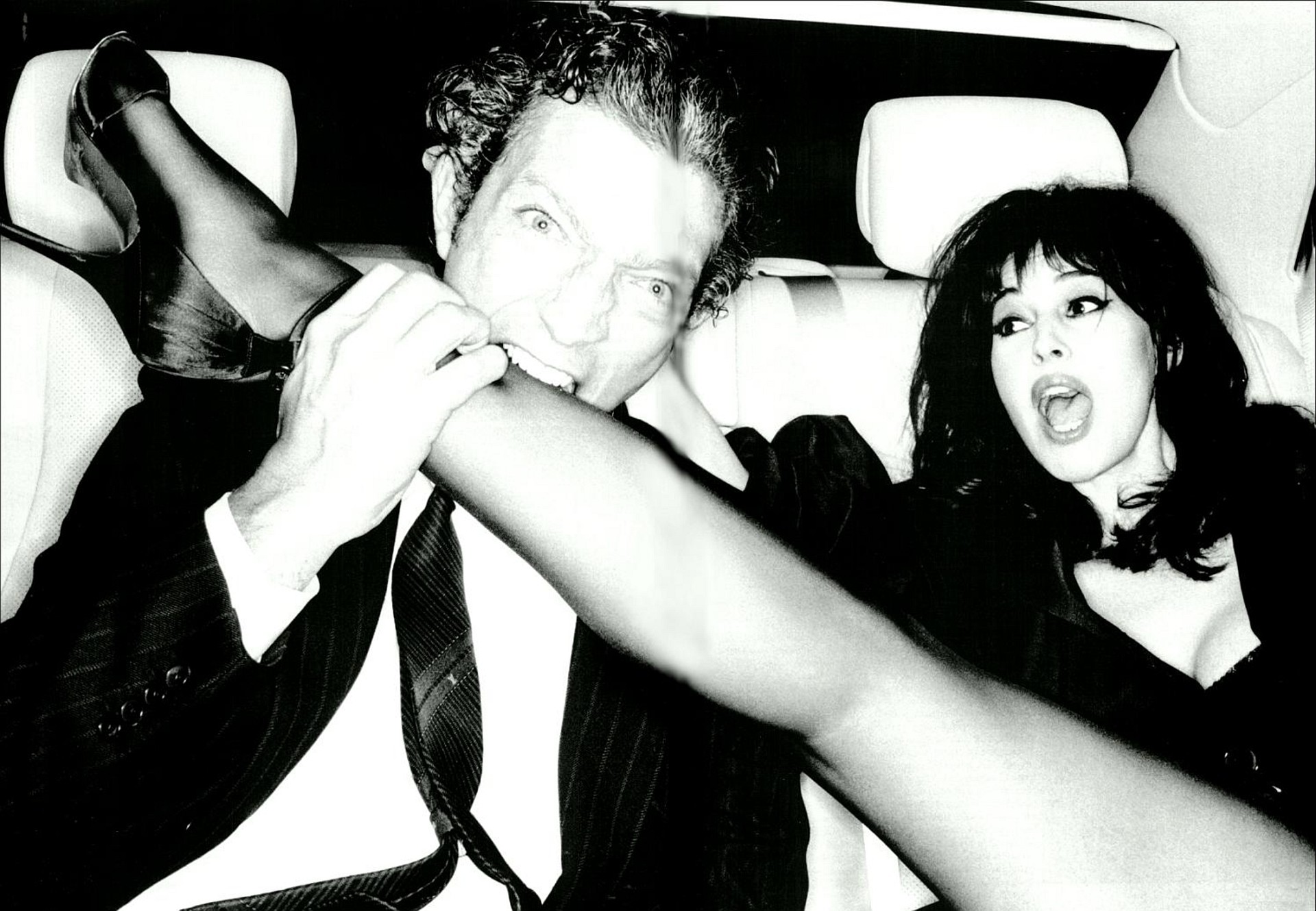 Monica Bellucci and man in car HD Wallpaper