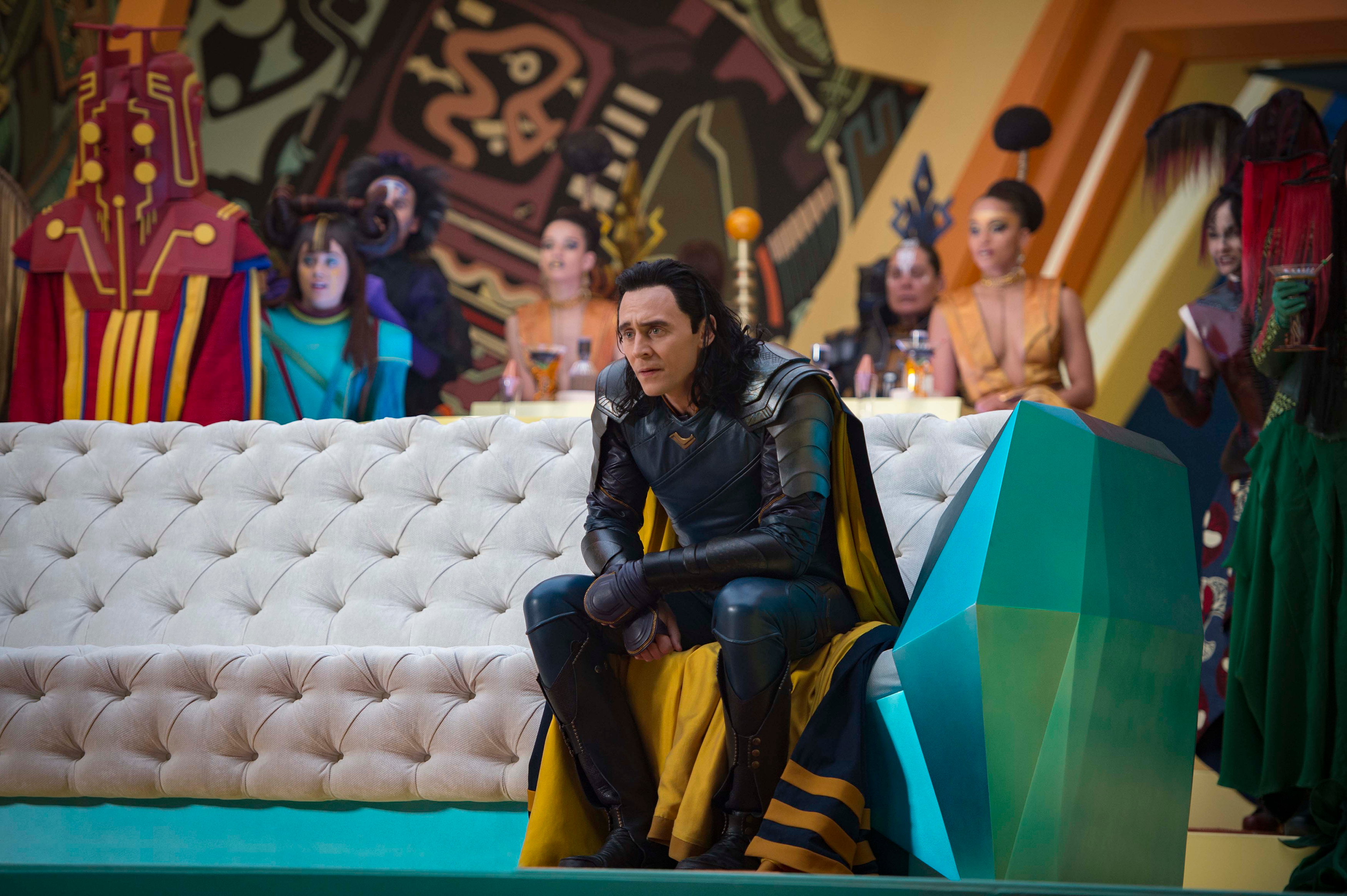 Loki from Thor sitting on a couch HD Wallpaper