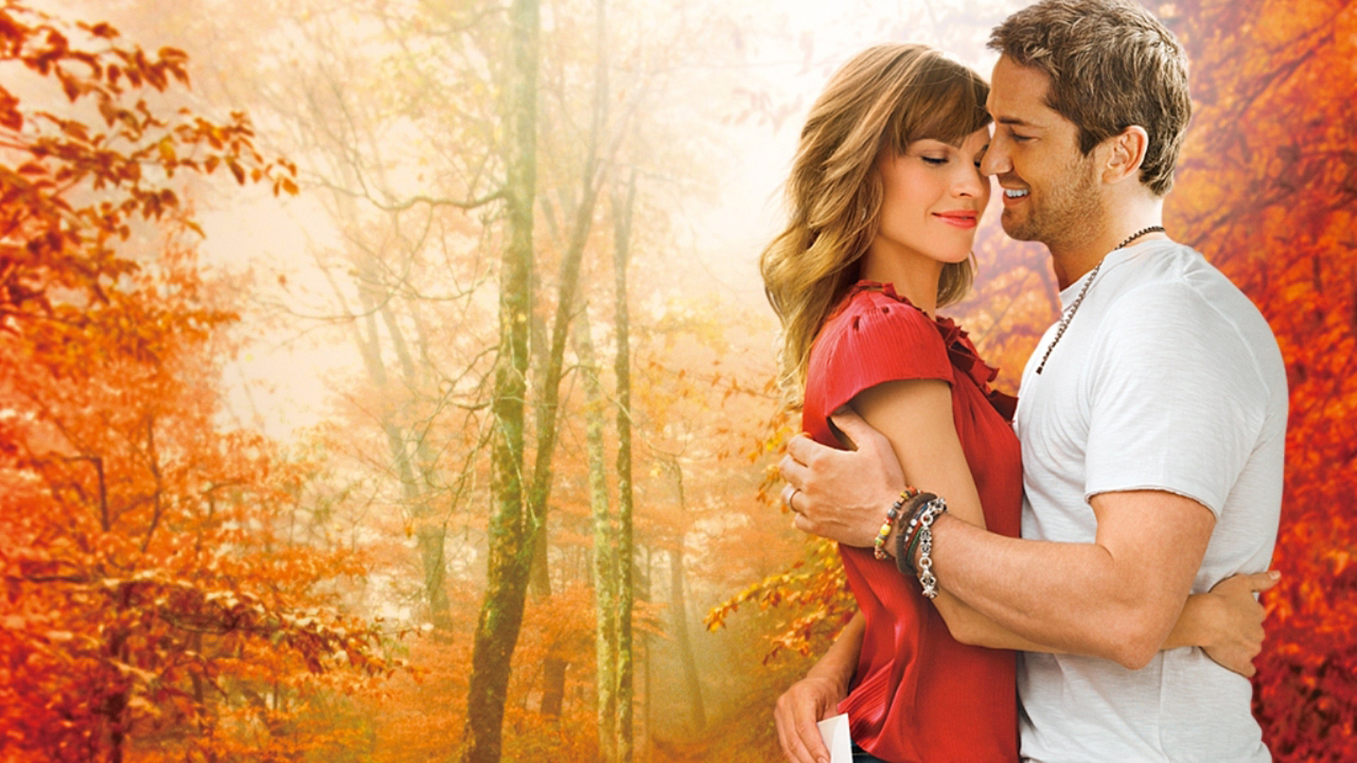 Gerard Butler and Hilary Swank embrace HD Wallpaper