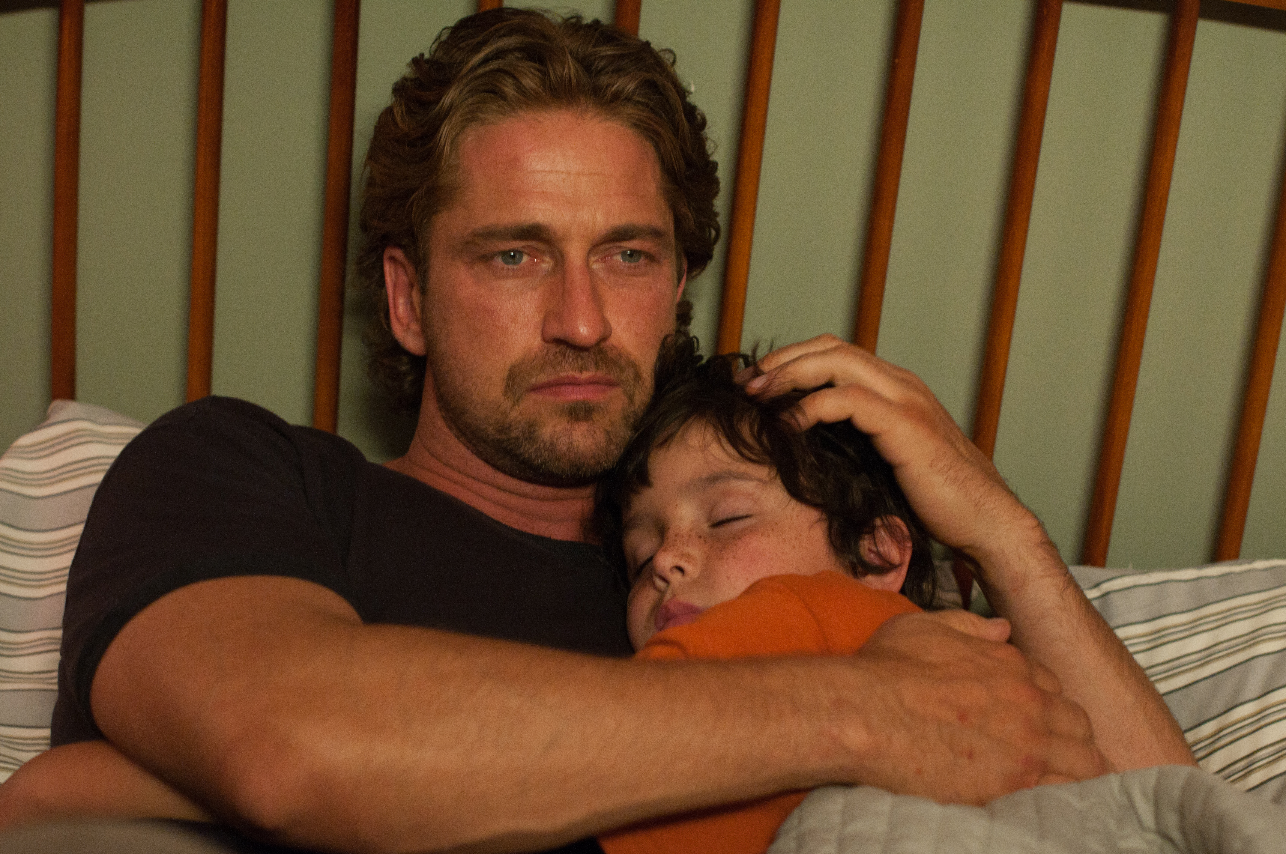 Gerard Butler with a sleeping child HD Wallpaper