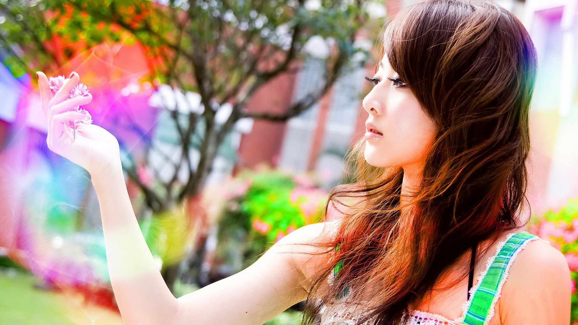 Young woman holding flowers with colorful light effects HD Wallpaper