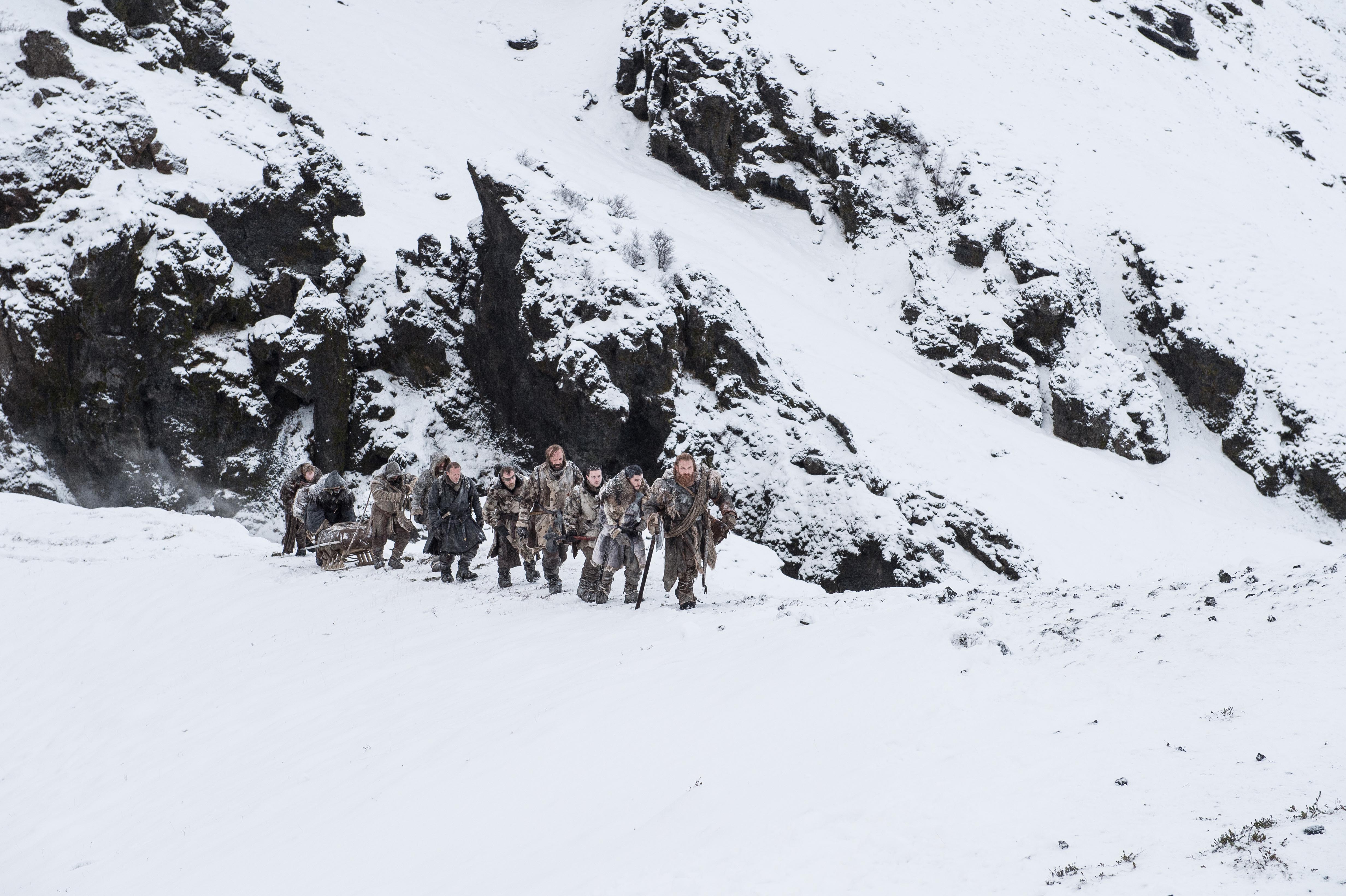 Rory McCann and group in snowy mountains HD Wallpaper