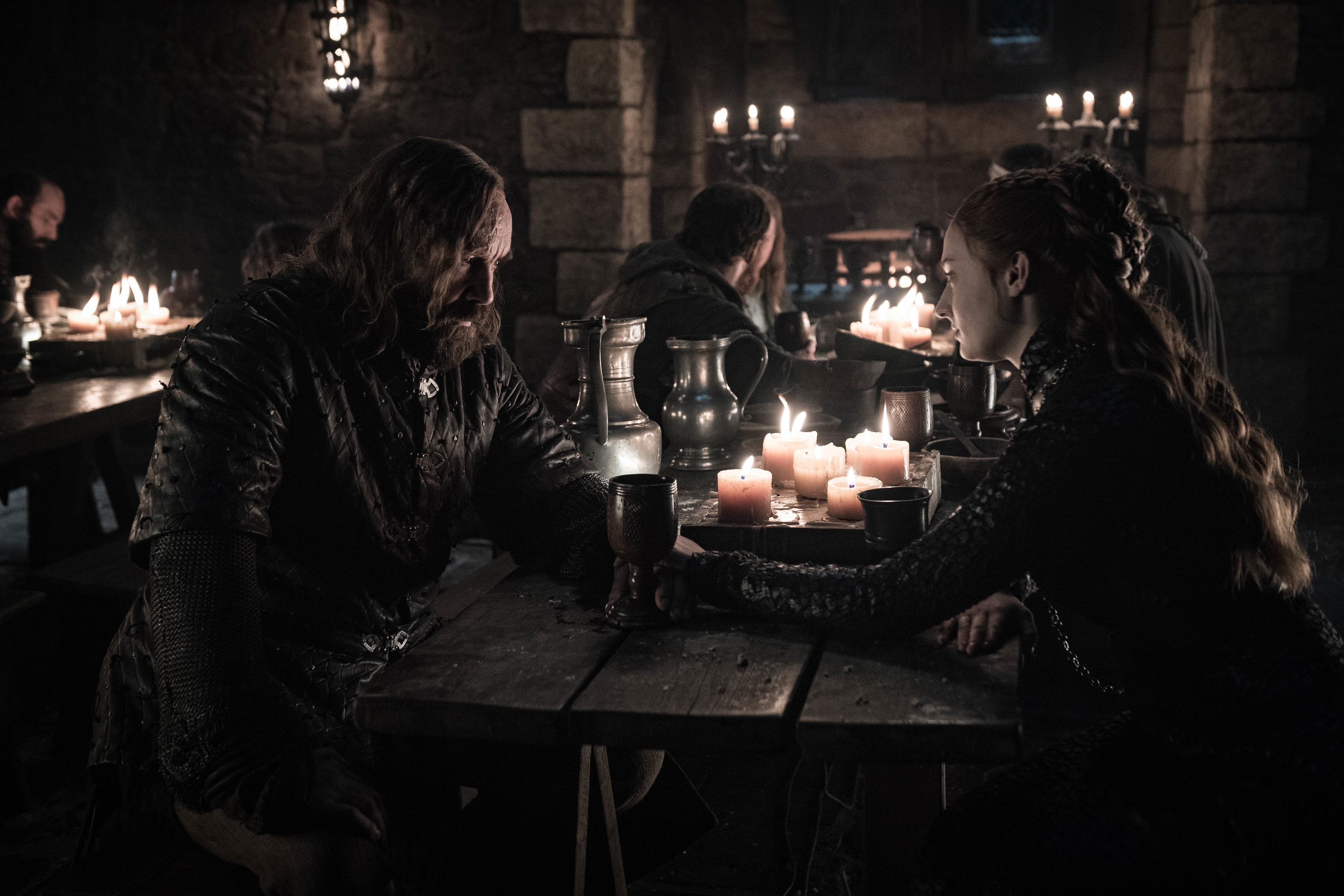 Rory McCann and Sansa Stark at a table HD Wallpaper
