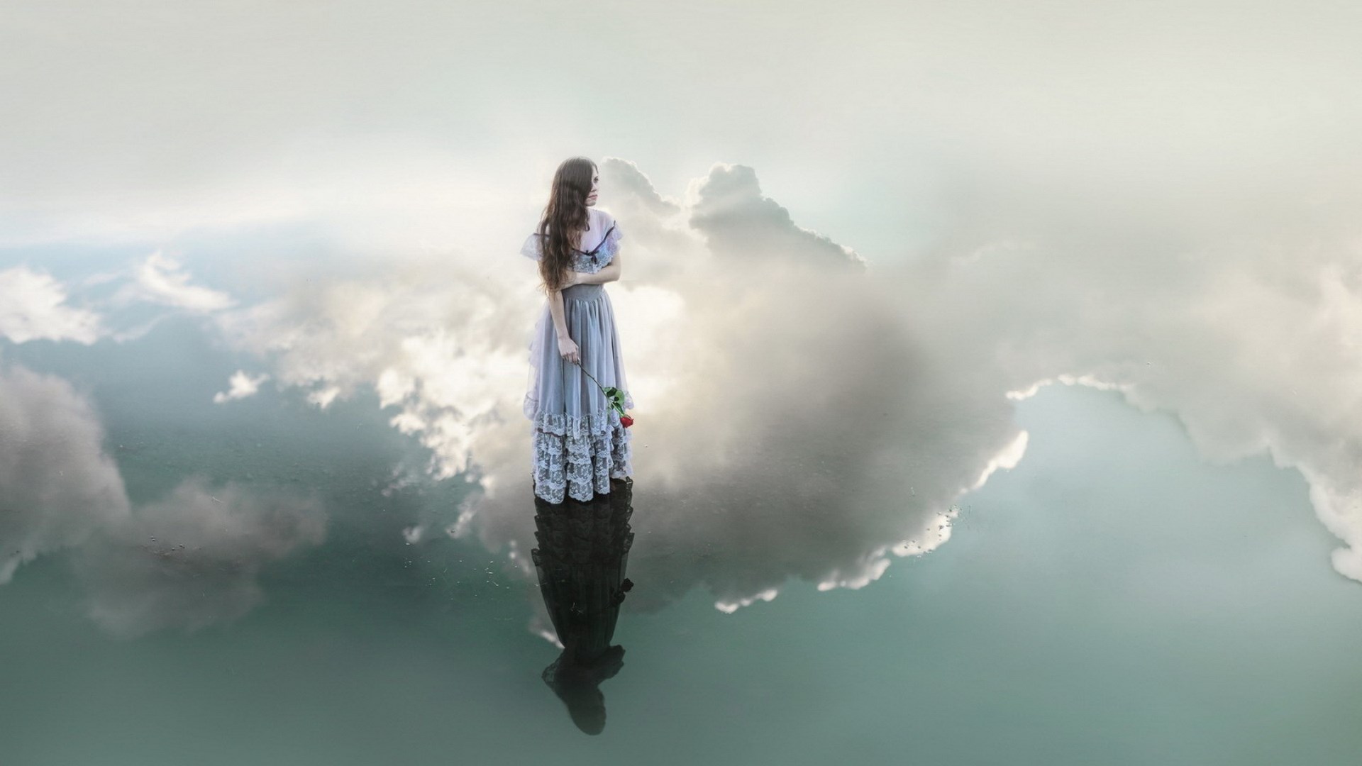 Woman in a dress holding a rose reflected in water HD Wallpaper