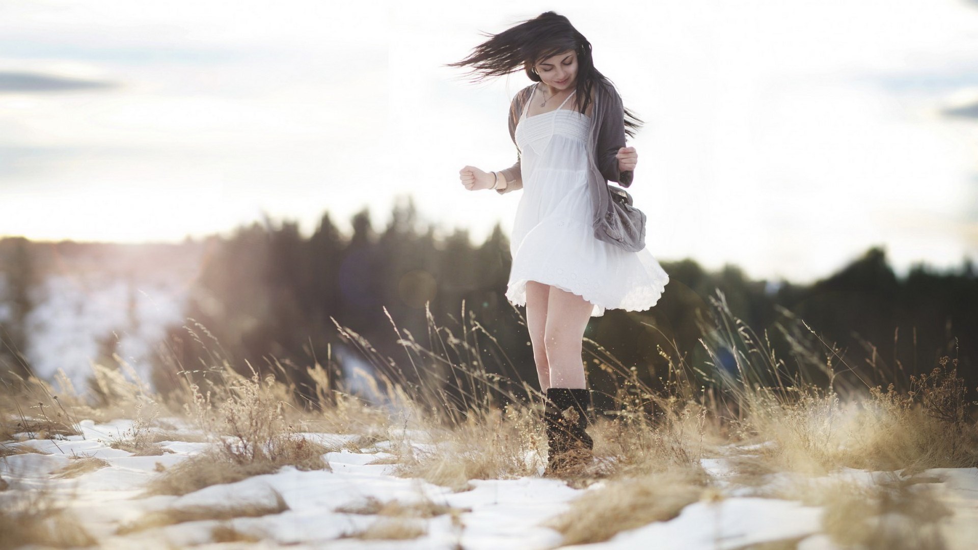 Woman in white dress in a snowy field HD Wallpaper