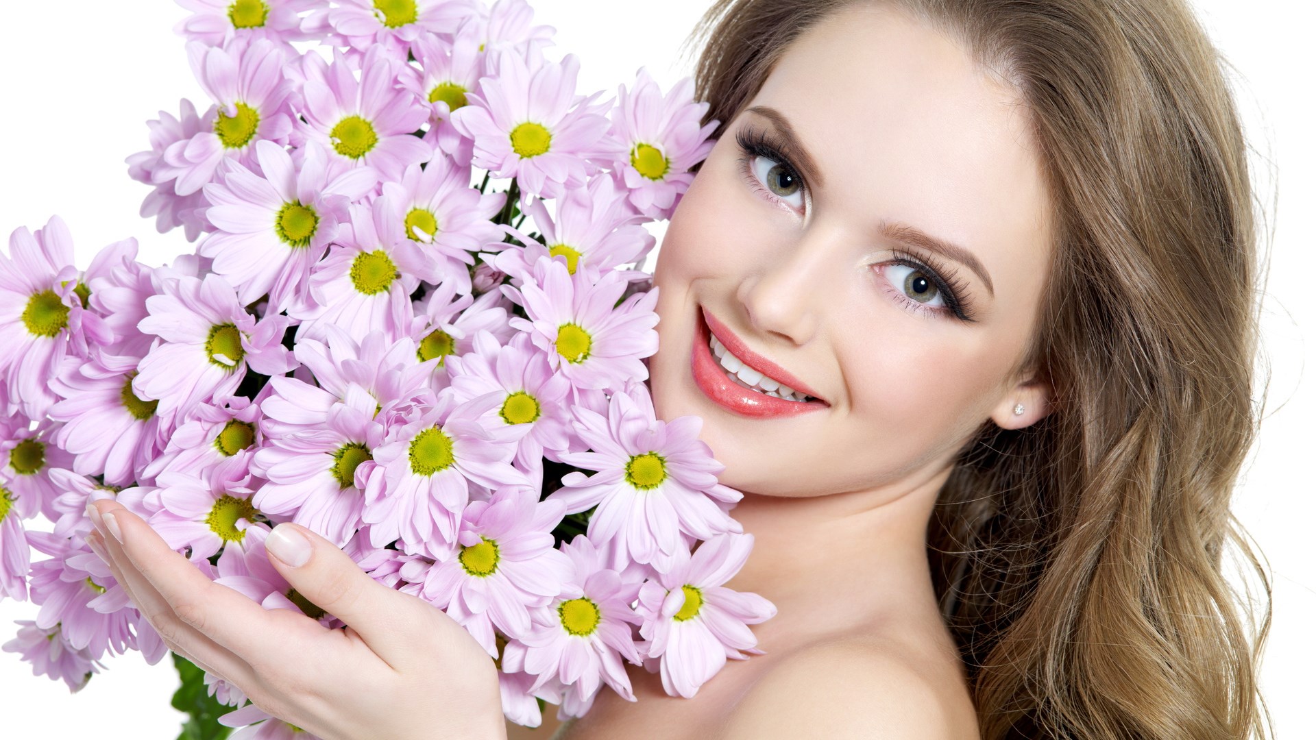 Woman holding pink daisies HD Wallpaper