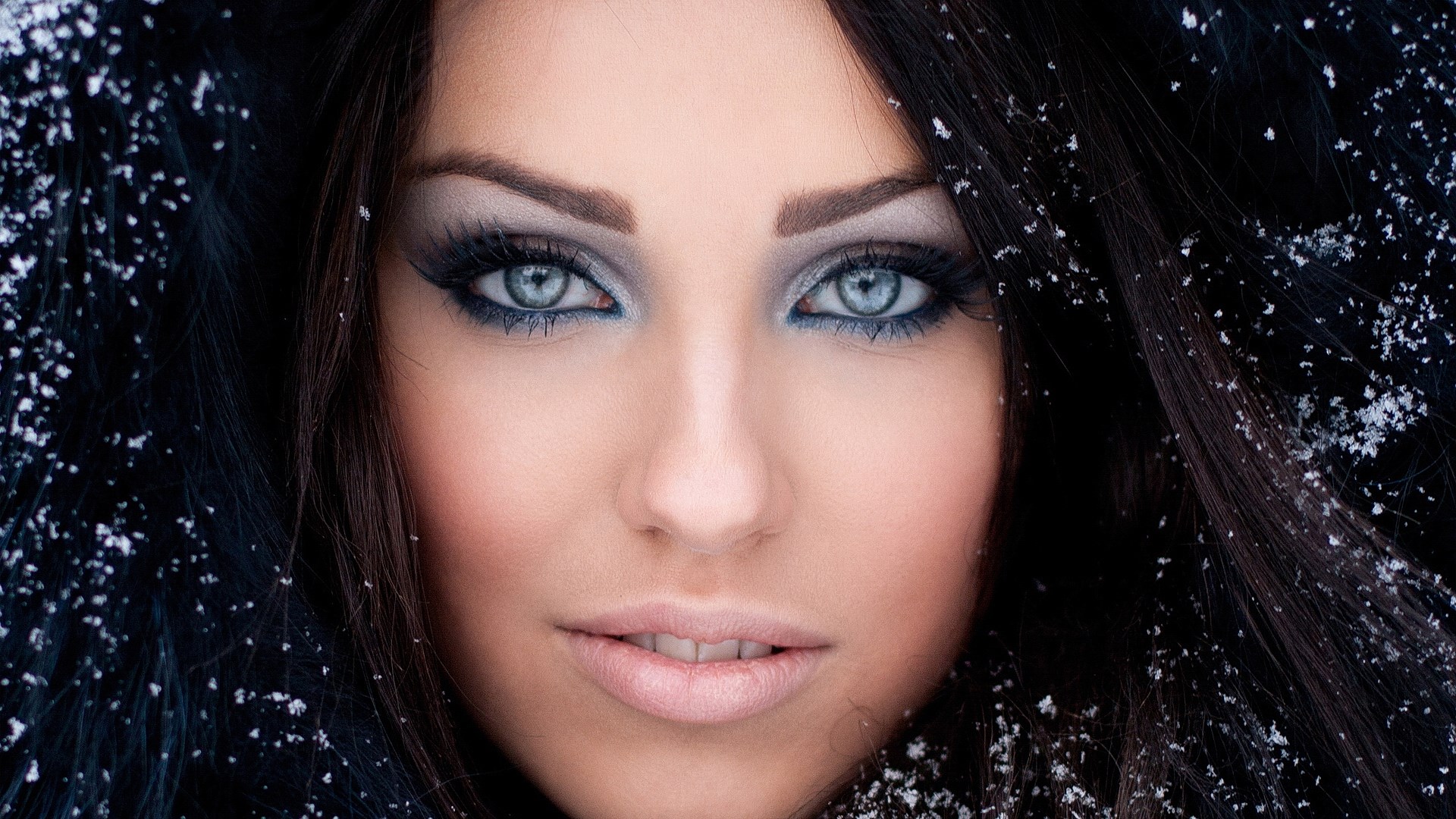 Woman with blue eyes and snow HD Wallpaper