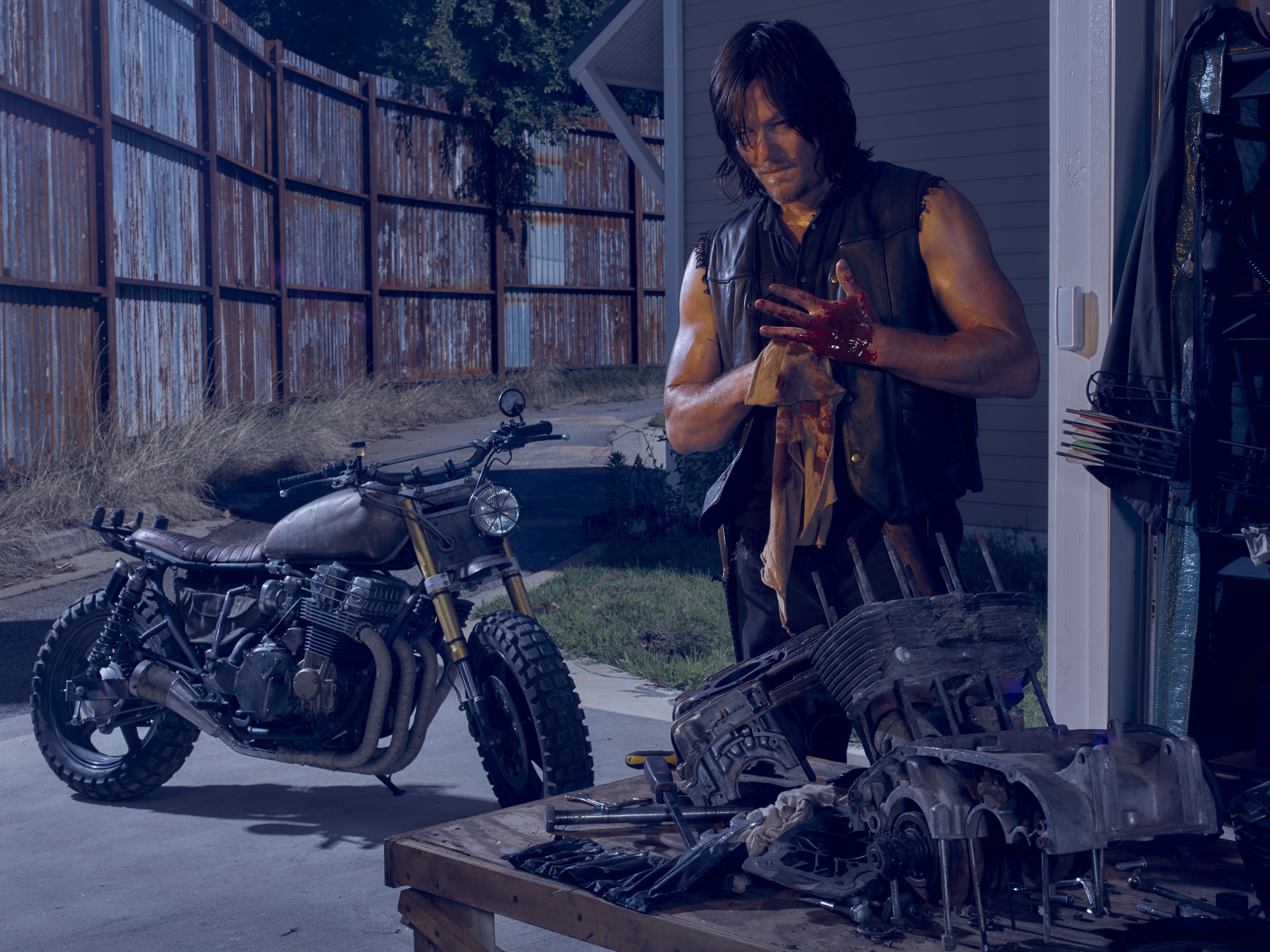 Norman Reedus with motorcycle engine HD Wallpaper